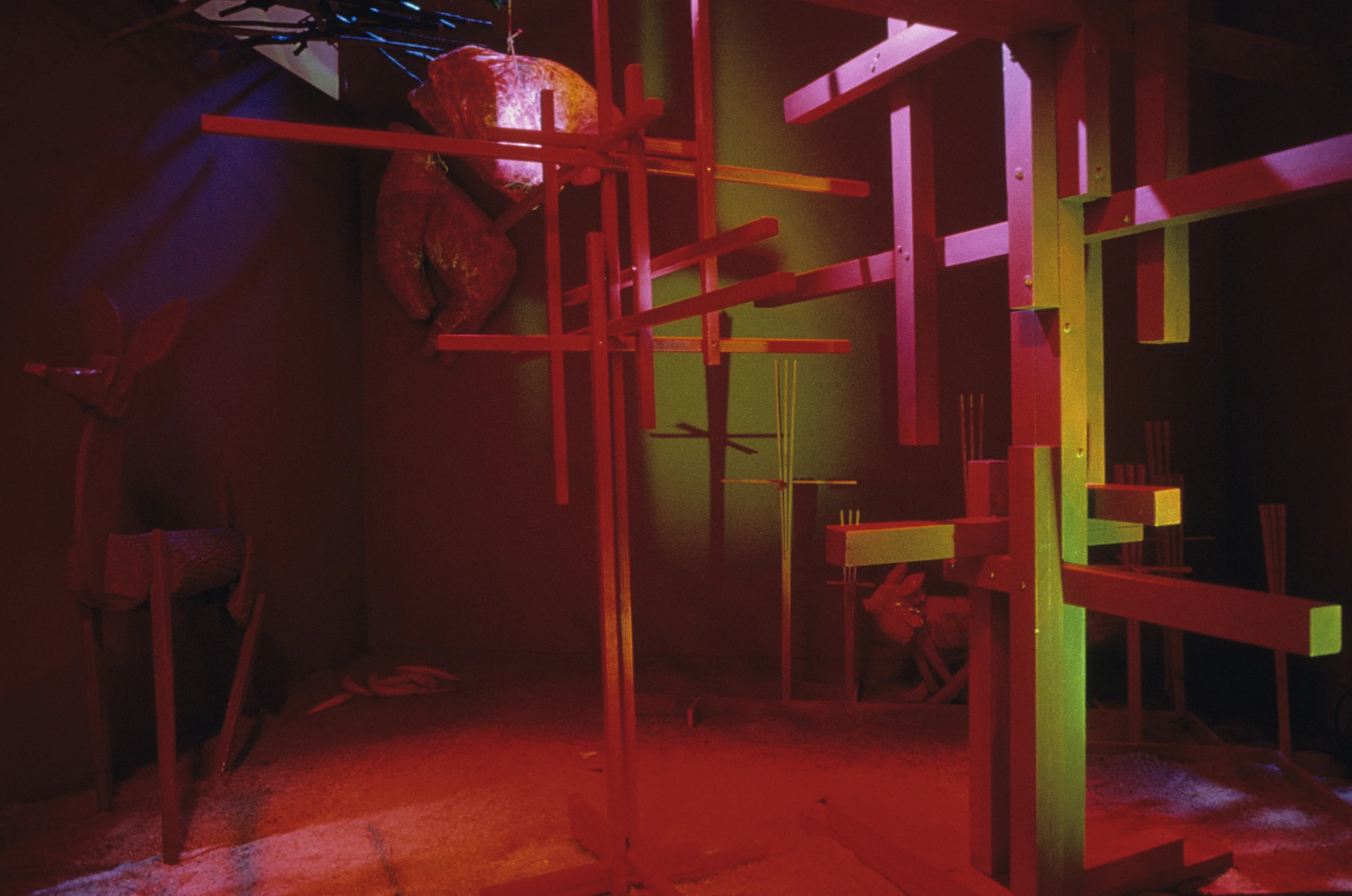 Red Room "exterior" shot. Deer, fox, suspended animal carcasses, "trees". 