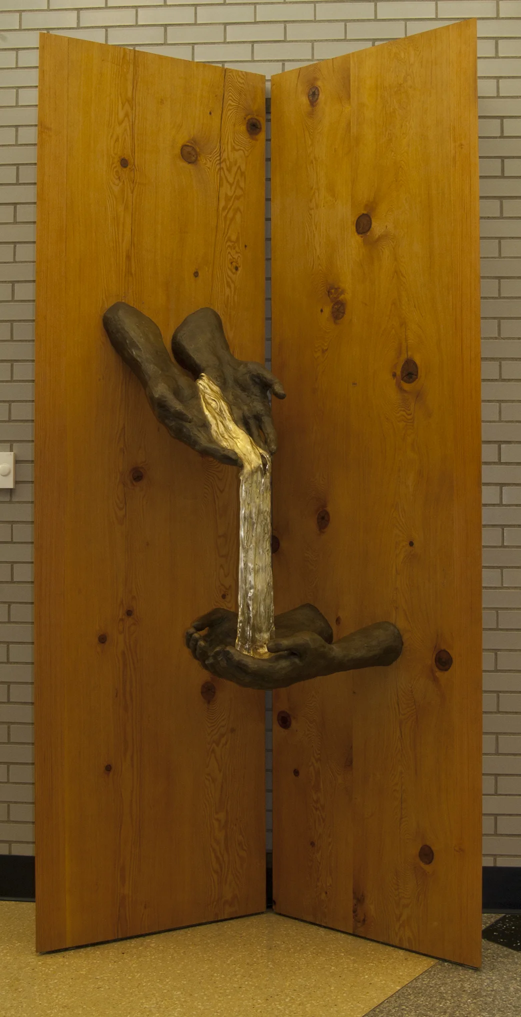Healing , 9 x 4 x 2, bronze, Douglas fir, steel. Lake Superior College, Duluth MN
