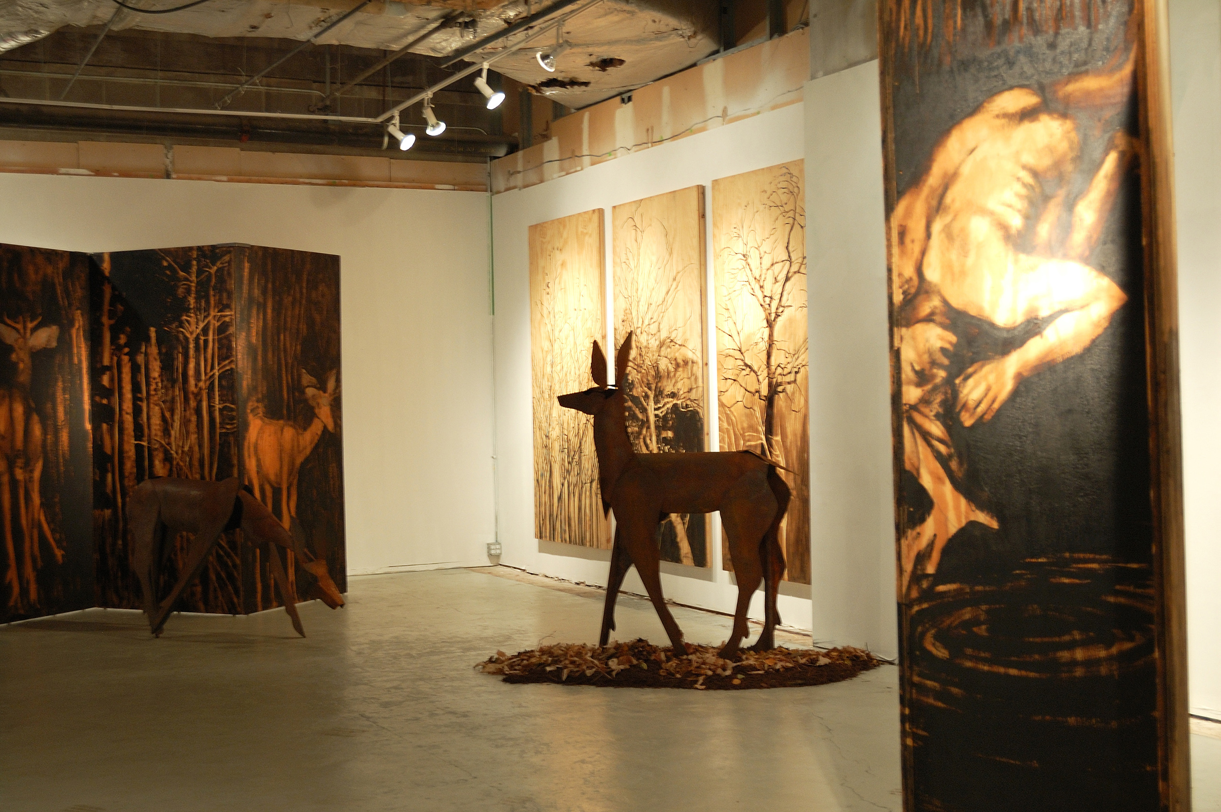  ​"Living Room" was a one-person show at Gallery 13, 811 LaSalle St., Minneapolis, MN. 
The animals are life-size, Corten steel, the panels, both freestanding 
and wall-hung, are each 4' x 8' plywood, painted in asphaltum.  