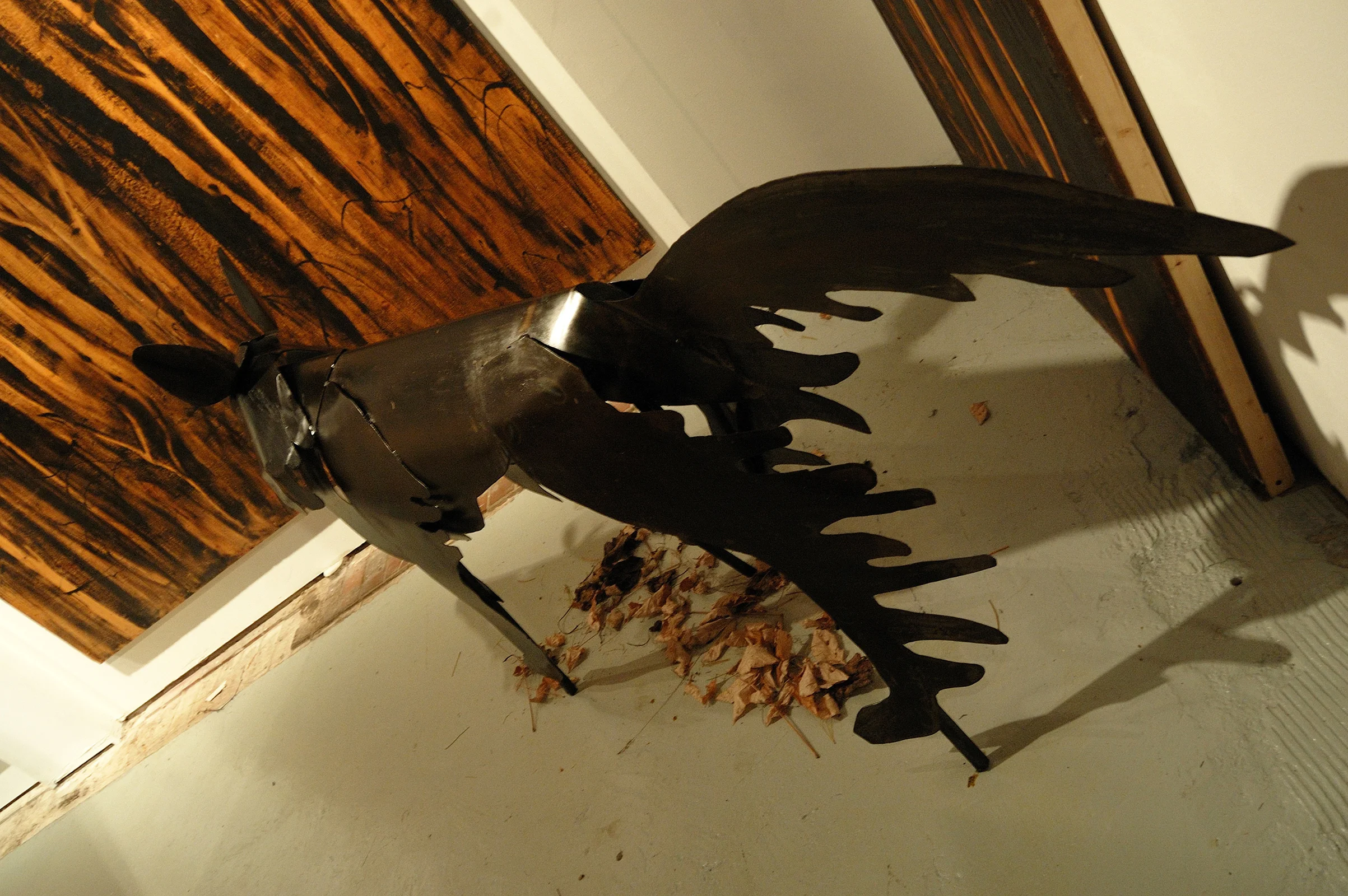 "Living Room" was a one-person show at Gallery 13, 811 LaSalle St., Minneapolis, MN.
The animals are life-size, Corten steel, the panels, both freestanding
and wall-hung, are each 4' x 8' plywood, painted in asphaltum. Grimm's Wolf, here, detail.