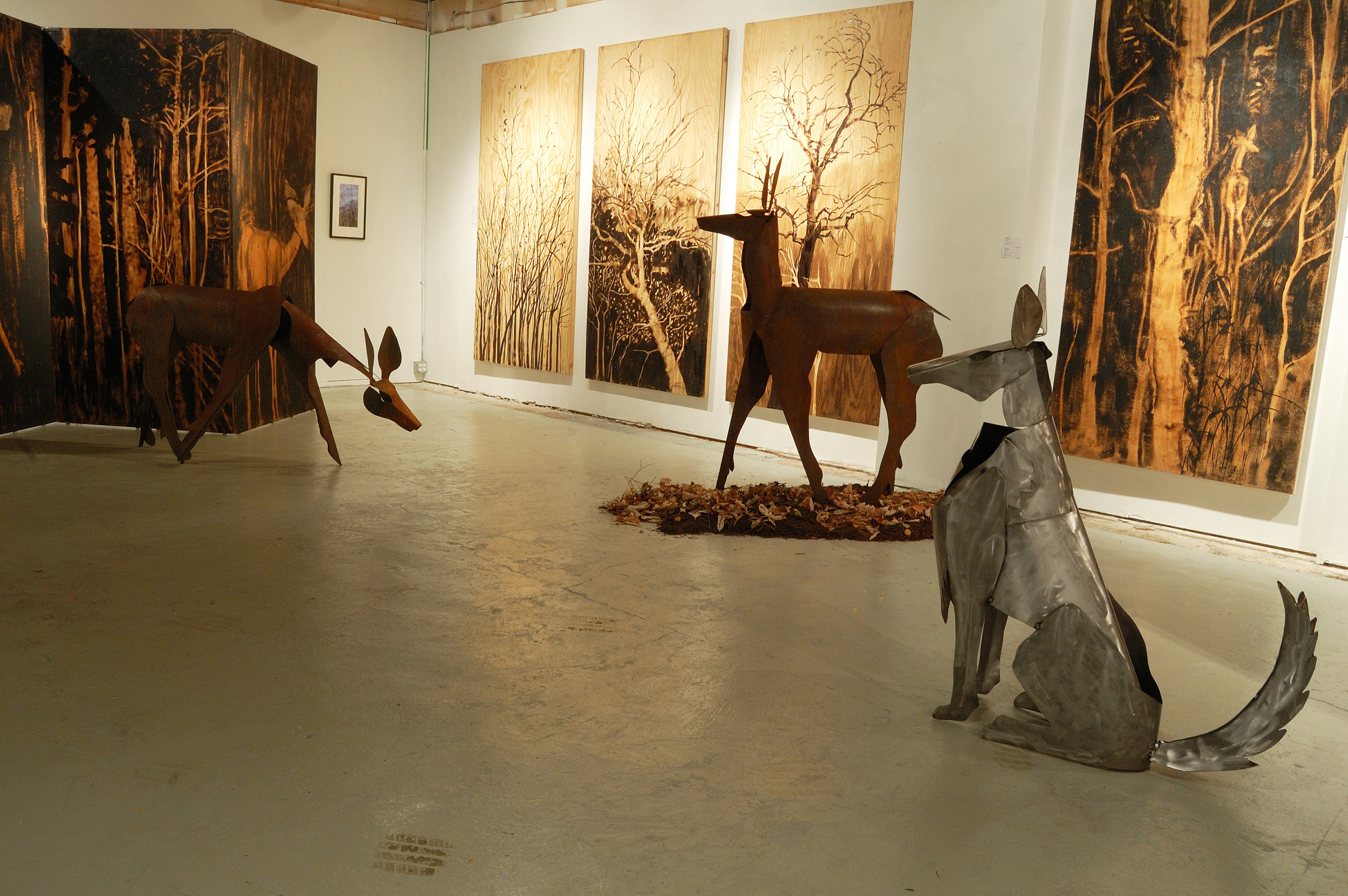  ​"Living Room" was a one-person show at Gallery 13, 811 LaSalle St., Minneapolis, MN. 
The animals are life-size, Corten steel, the panels, both freestanding 
and wall-hung, are each 4' x 8' plywood, painted in asphaltum. Here is the other wolf, sea