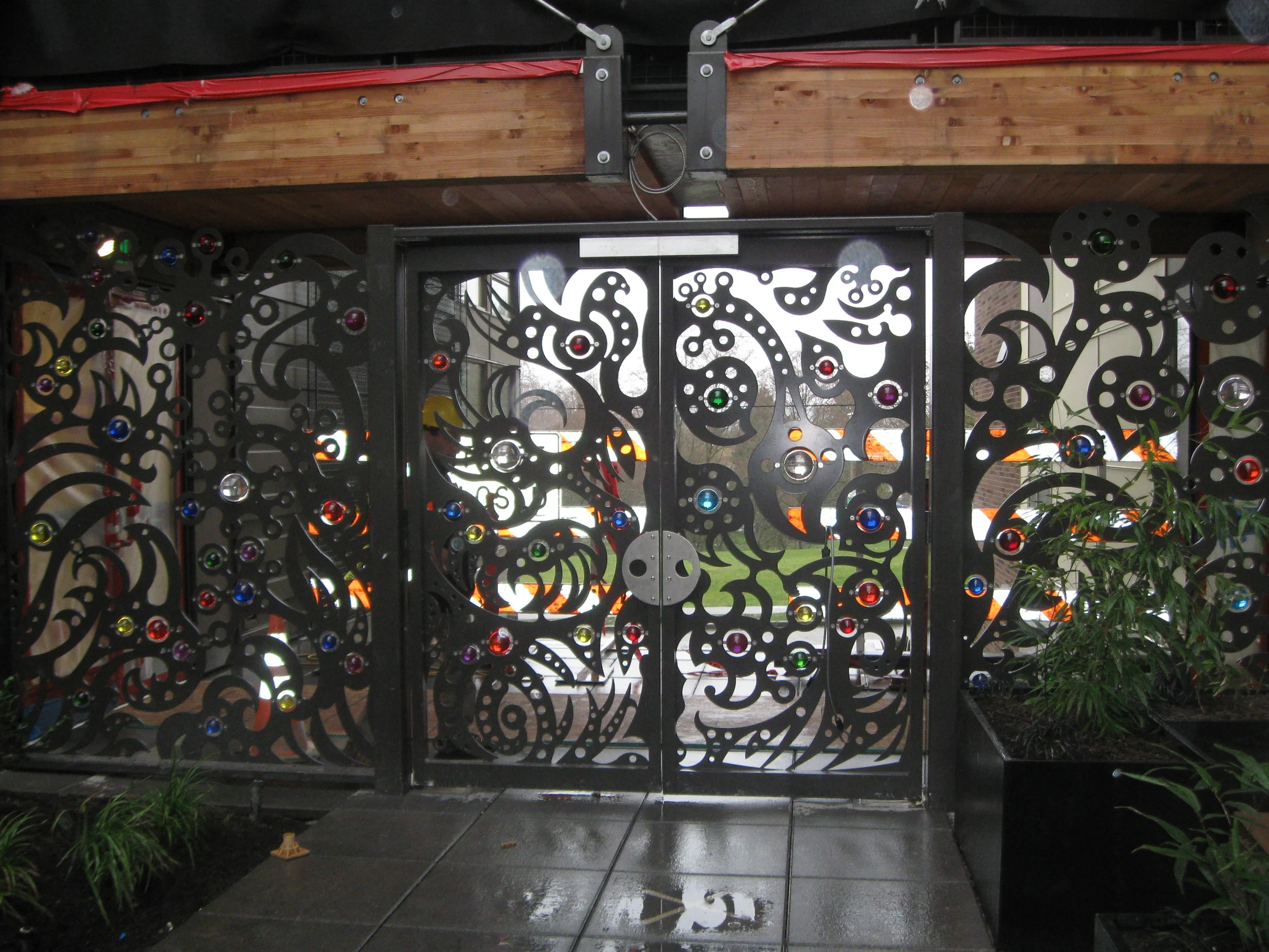 "Station Building Courtyard Gate", laser cut steel and glass, 25'x8', 2011