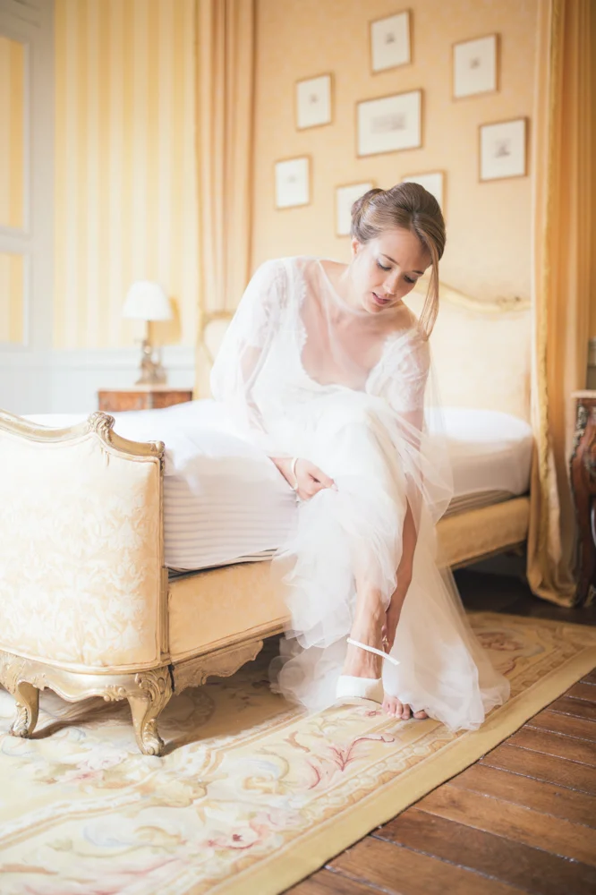 bride-putting-on-shoes.jpg