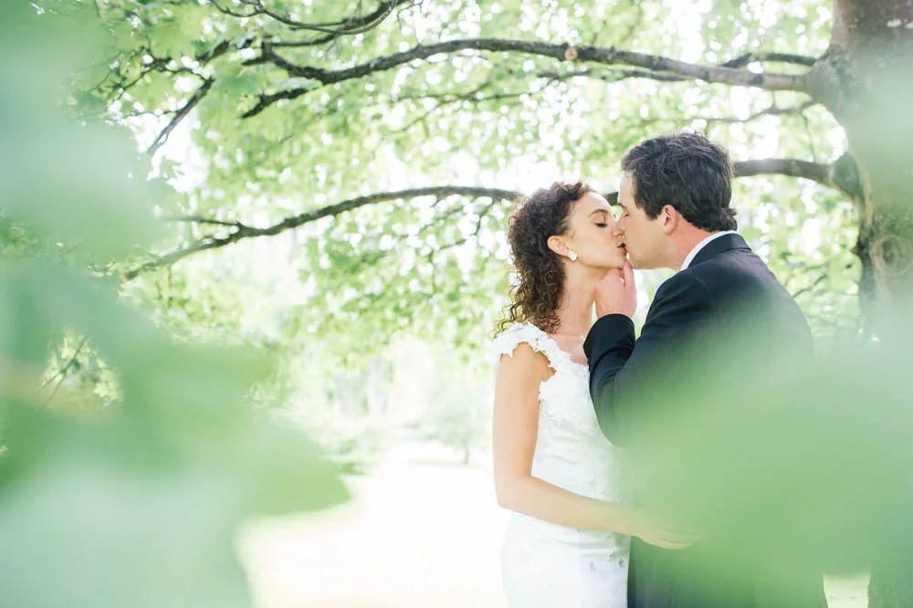 couple-kissing-under-tree.jpg