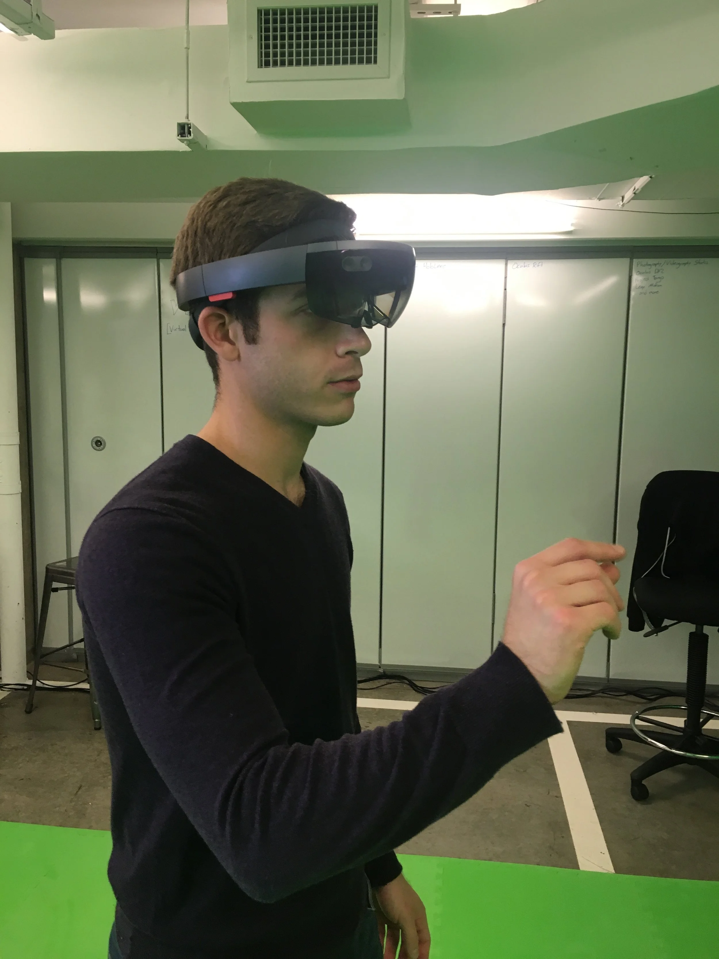 jesse test-drives a Microsoft HoloLens mixed reality headset at one of his group's events.