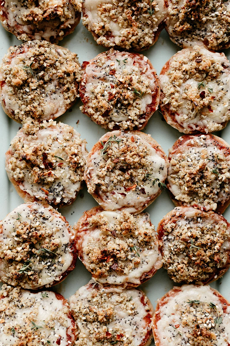 mini pizza bagels with sharp cheddar and walnut crumble — molly yeh