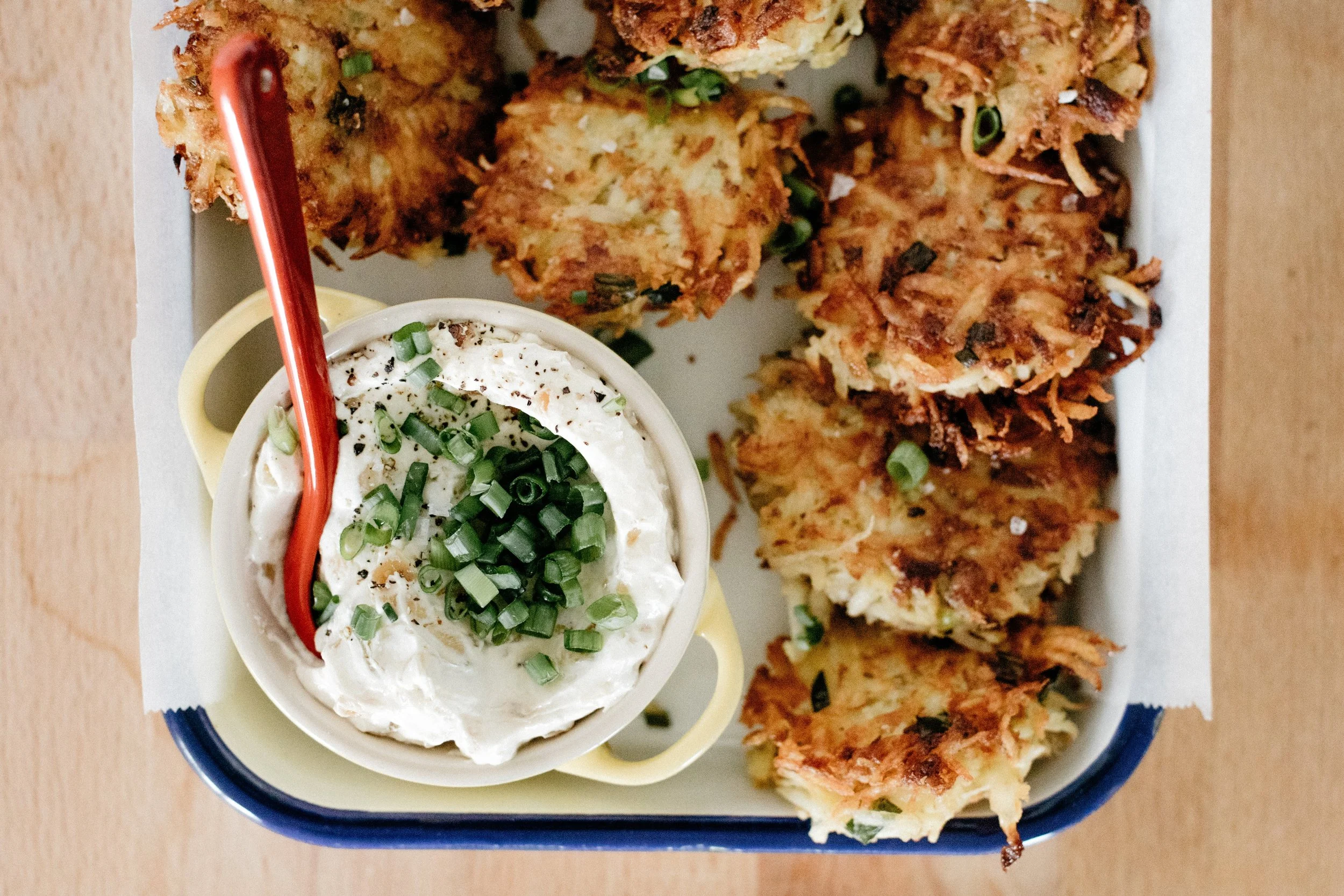 garlic and onion latkes and sour cream — molly yeh