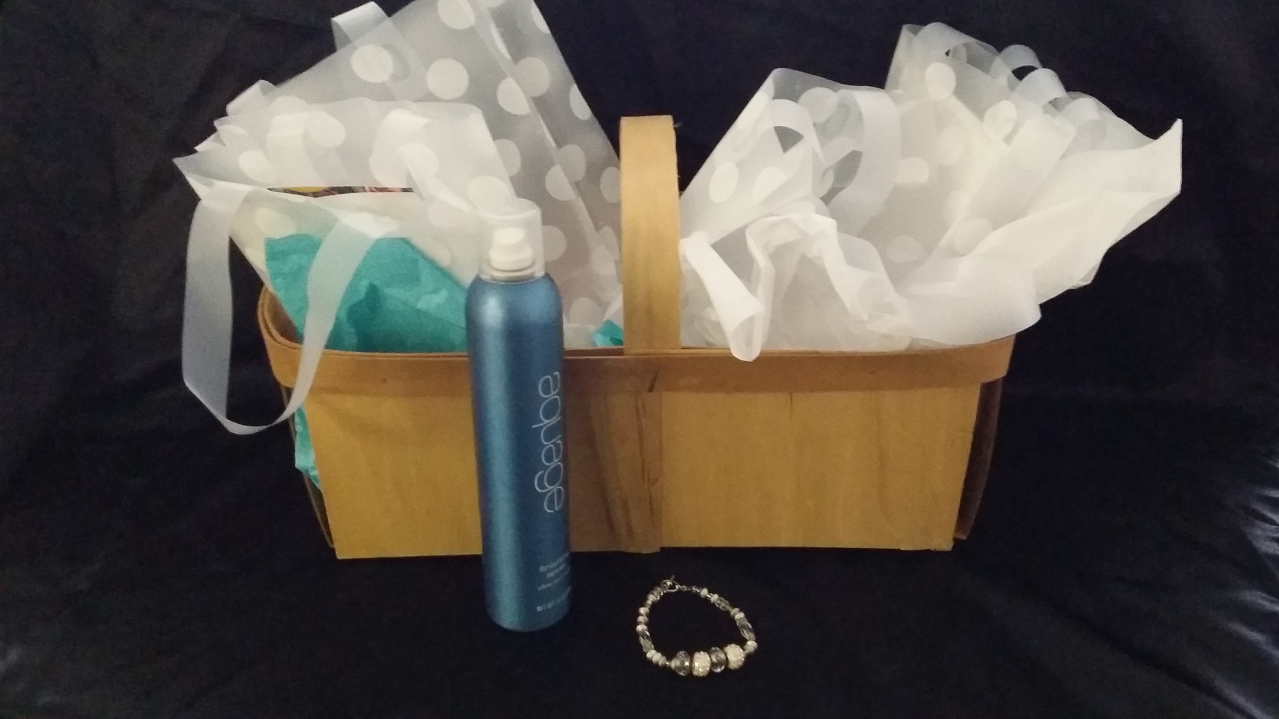 Jackie's Beauty Place & Boutique Gift Basket includes: Highlight/Haircut/Style, Hairspray, Spa Pedicure and Bracelet Value: $127 Starting Bid: $75