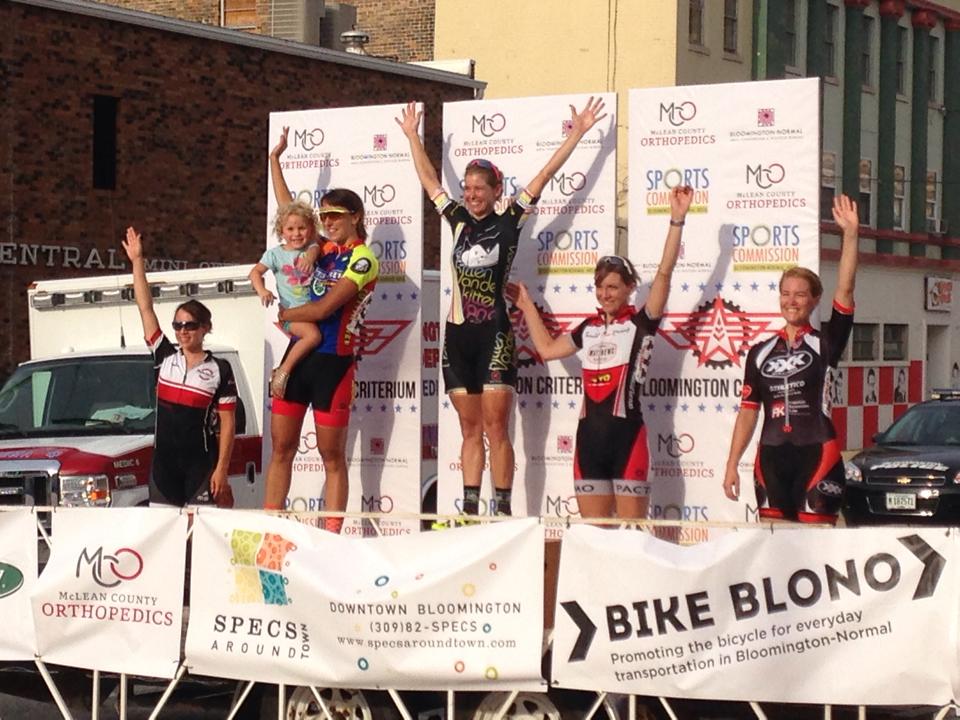 Daphne and niece Cora take applause from the crowd at the Bloomington Criterium