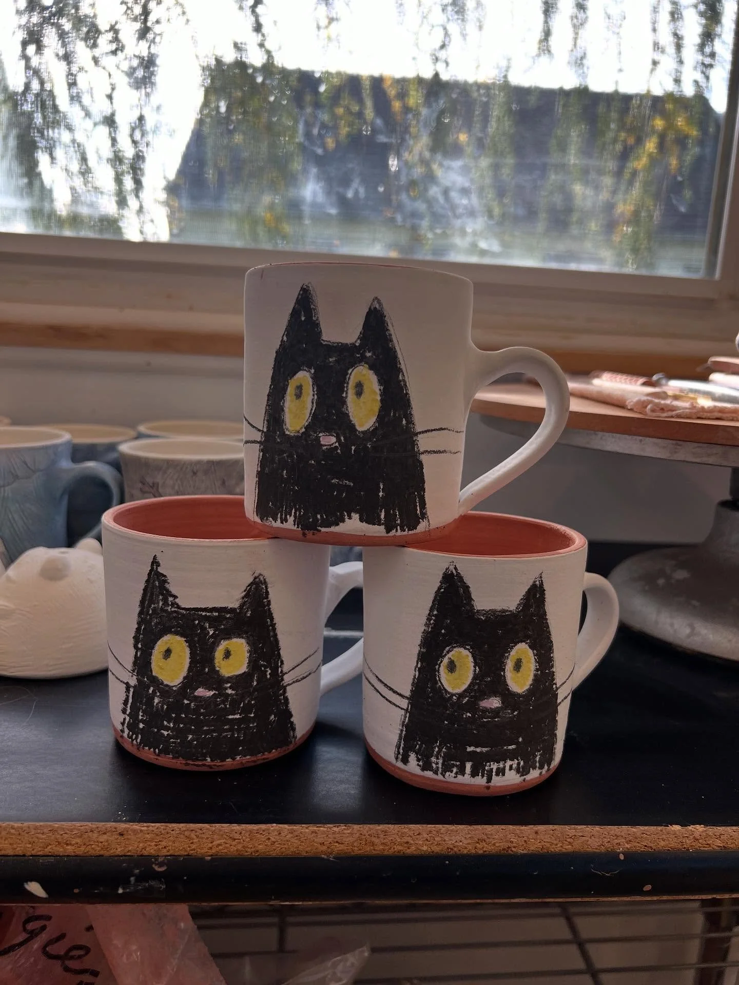 Who thinks these underglaze chalk cats will disappear after the glaze fire???