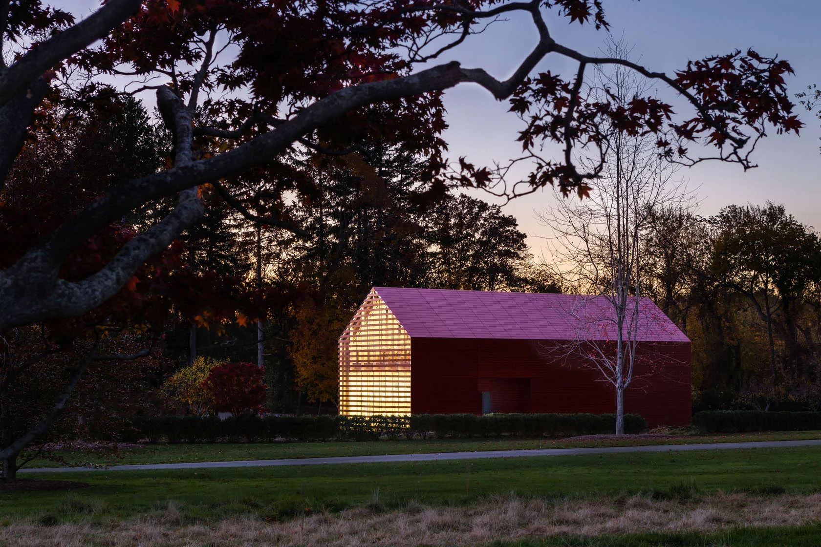 Overall dusk view of Red Barn designed by Roger Ferris + Partners