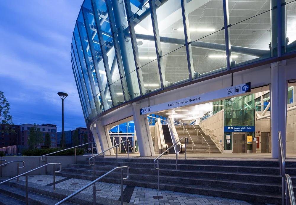 Detail shot of the PATH Harrison Station at dusk. Designed by Dattner Architects