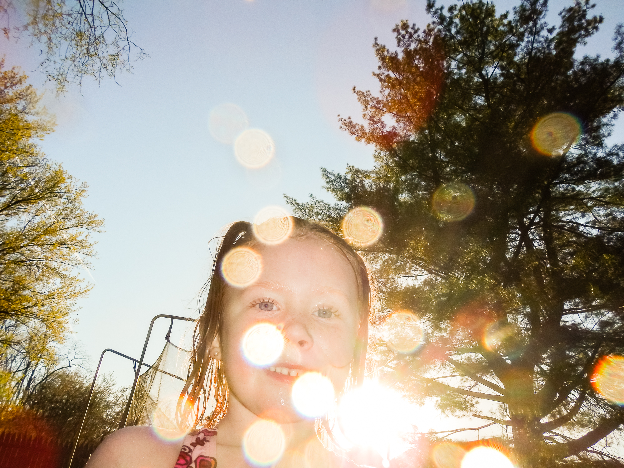 I was shooting directly into the sun with the flash cranked as much as possible. it's a good way to keep the sky blue rather than blowing it out to white.