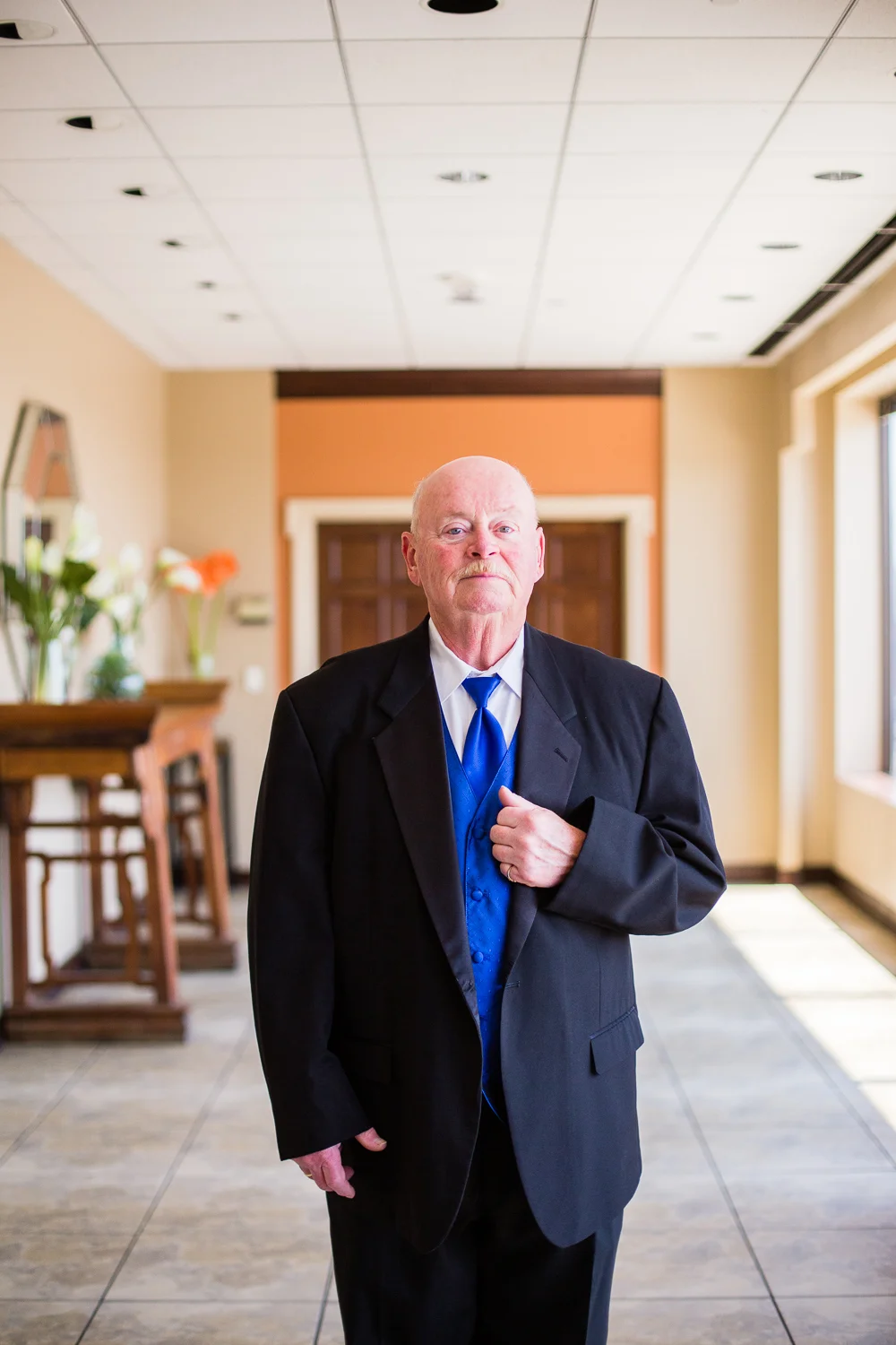 Dad stood for a portrait while waiting to see Maggie in her dress for the first time.