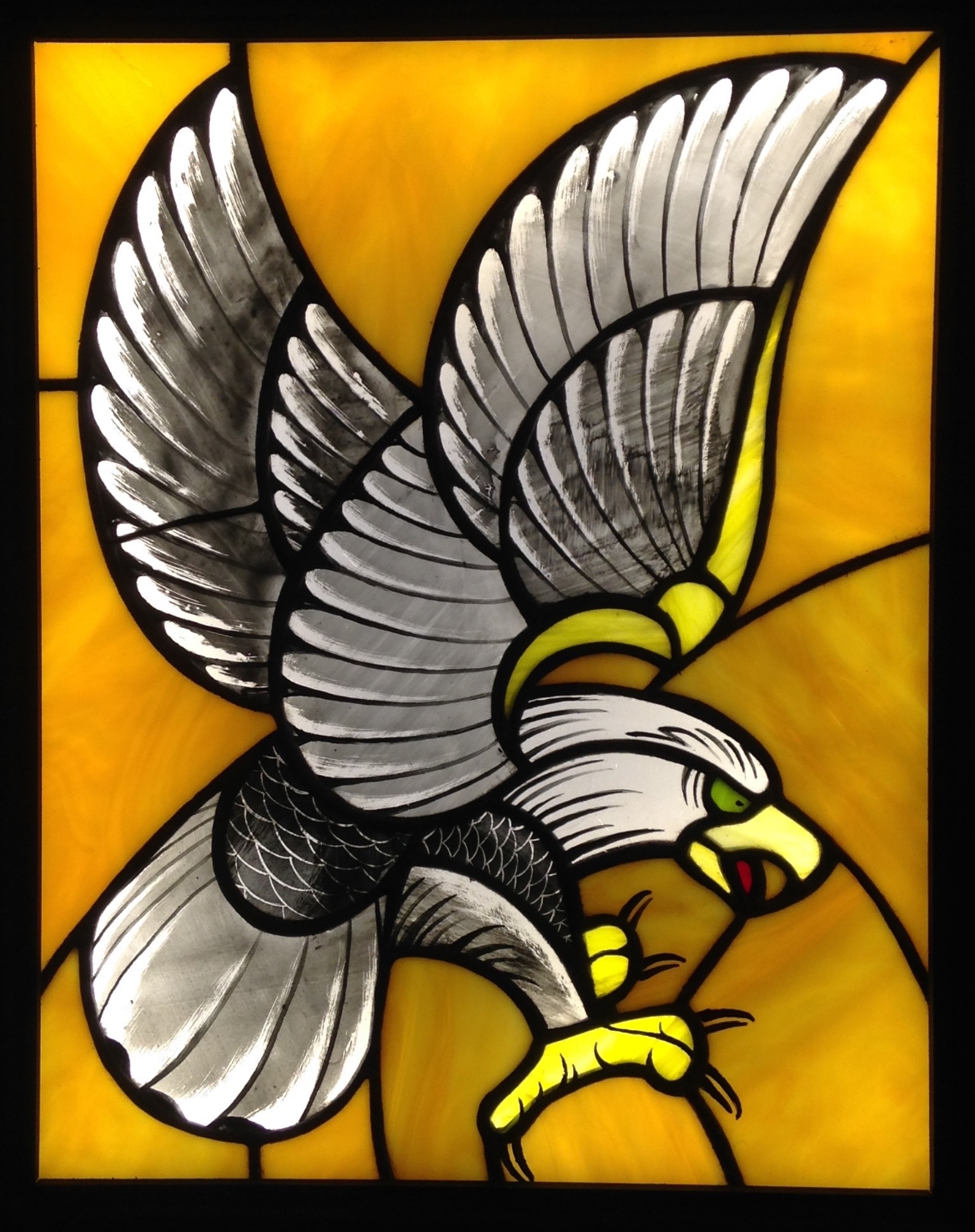"SCREAMIN' EAGLE" 11"X14"(SIZE OF JUST GLASS) Foiled stained glass, kiln fired glass paint, & LED lights  $1250