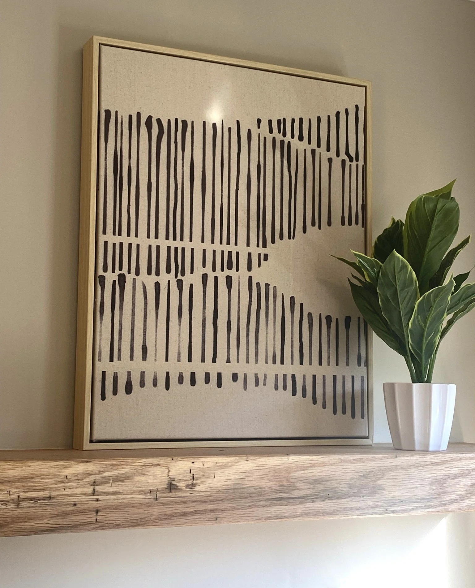 floating shelf with art.JPEG