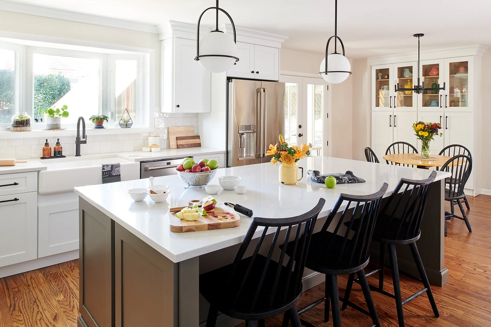Island with black wood stools.