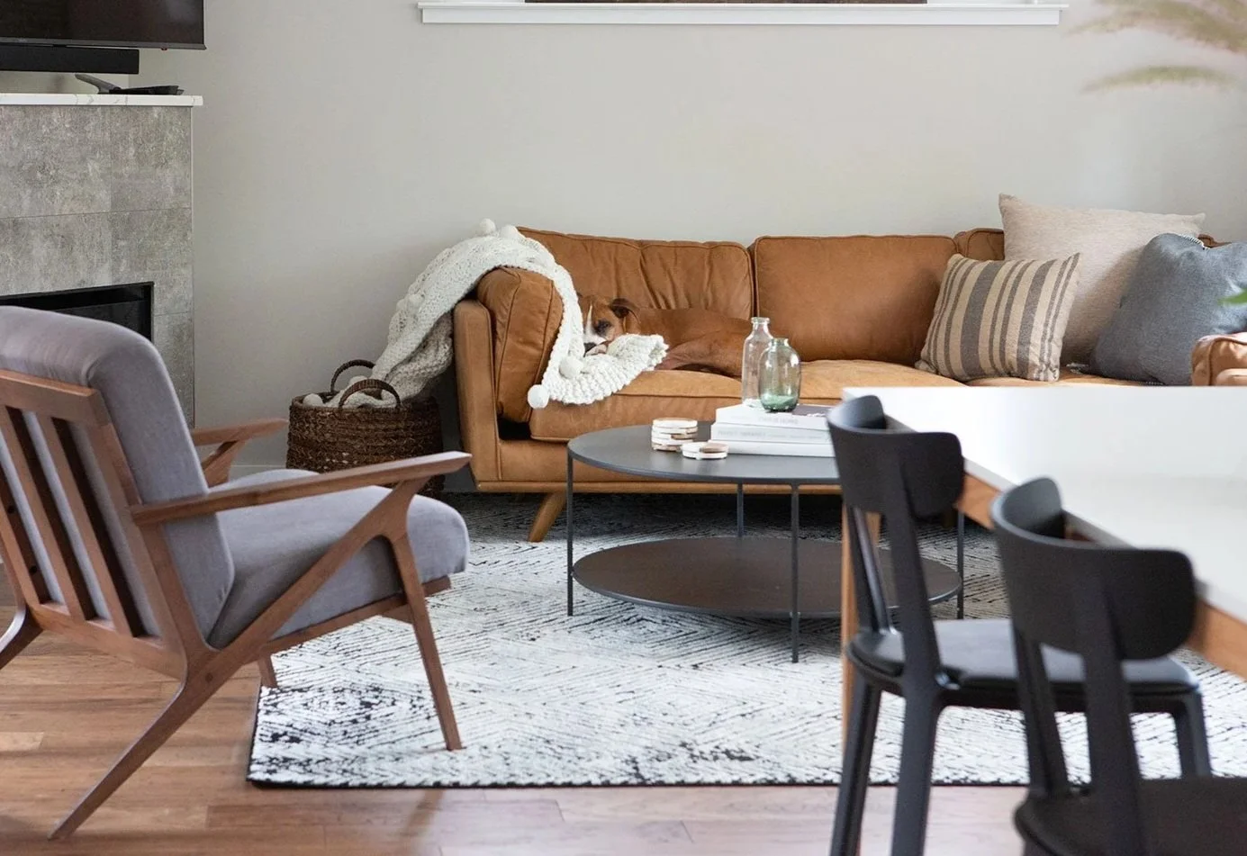 Living room with leather sofa and gray accent chair.