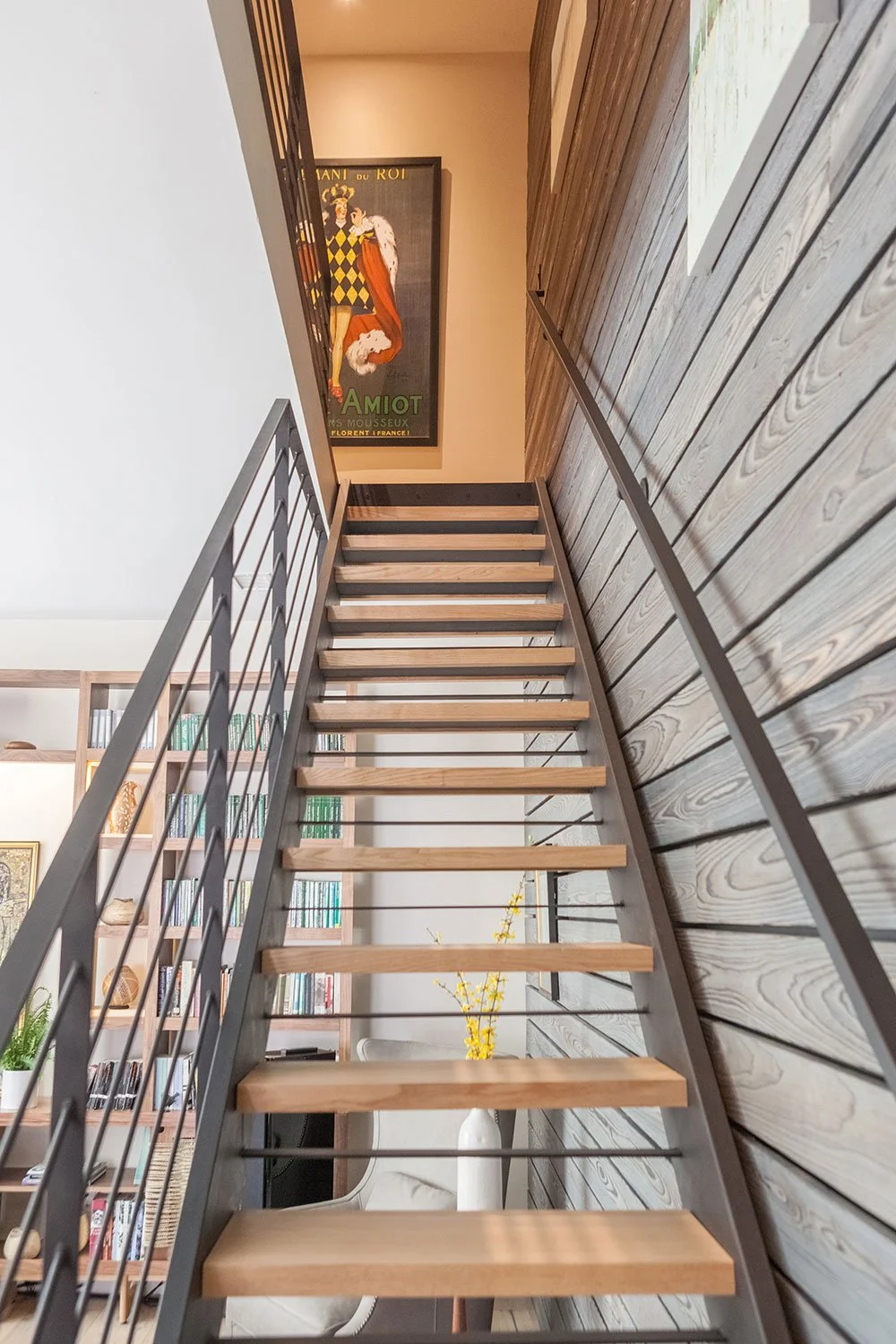 Black staircase with oak wood treads.