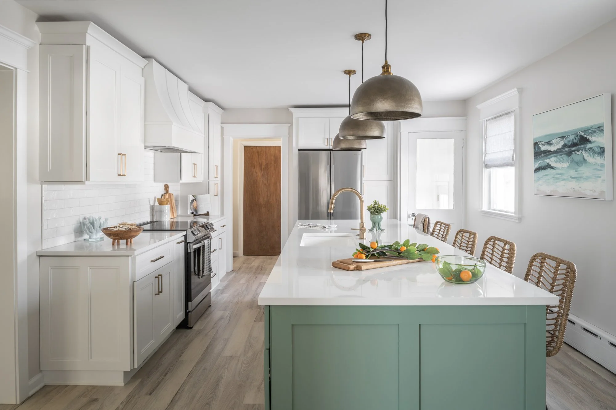 White kitchen with white island.