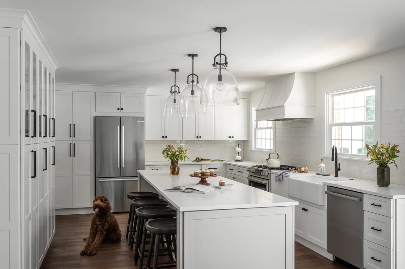 Large kitchen island with wood stools.