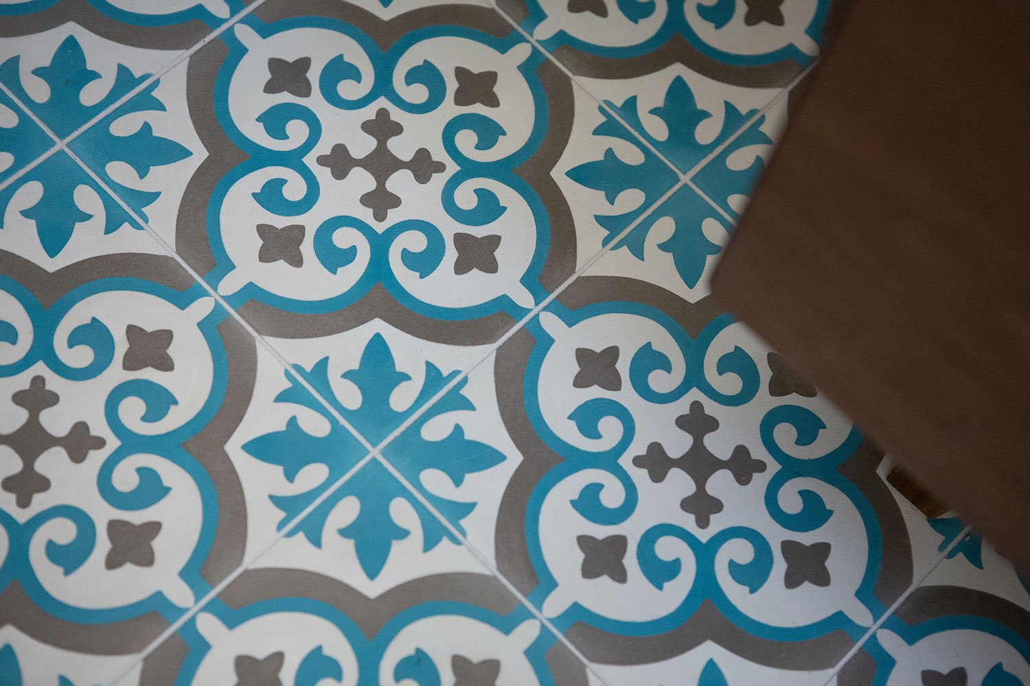 Gray and teal cement bathroom tile.