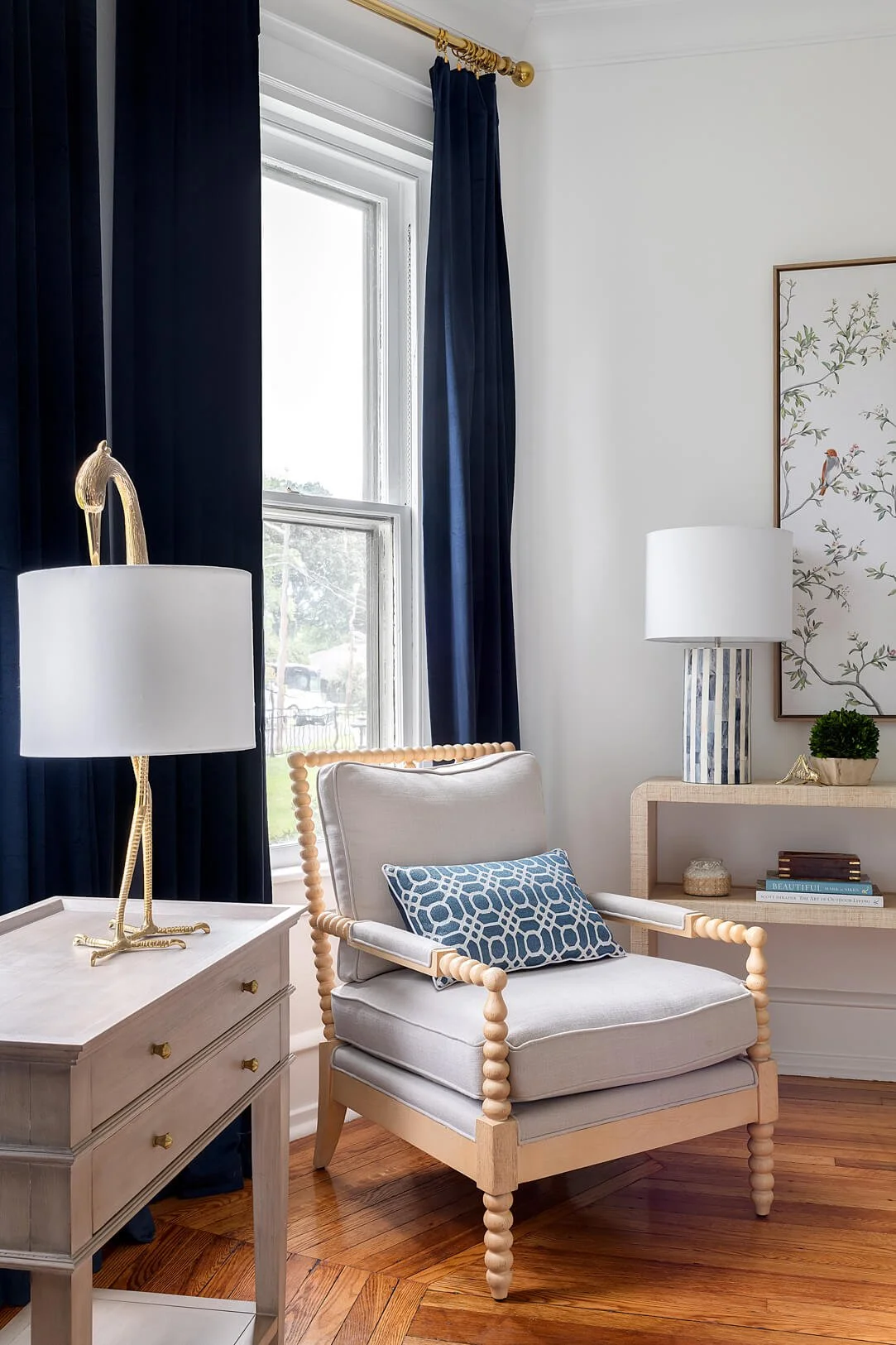 Accent chair in front of bay window.