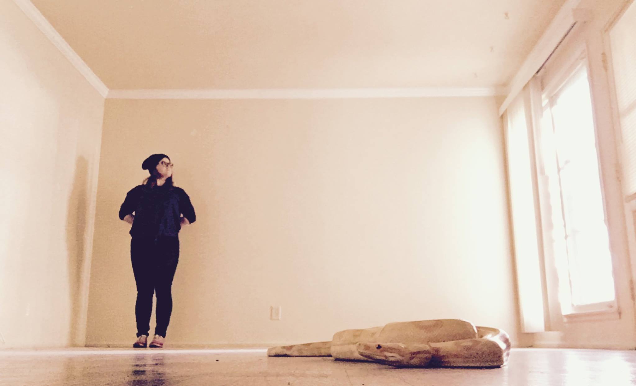 Ruben the snake and I in our empty LA apartment on moving day. Jan 2017