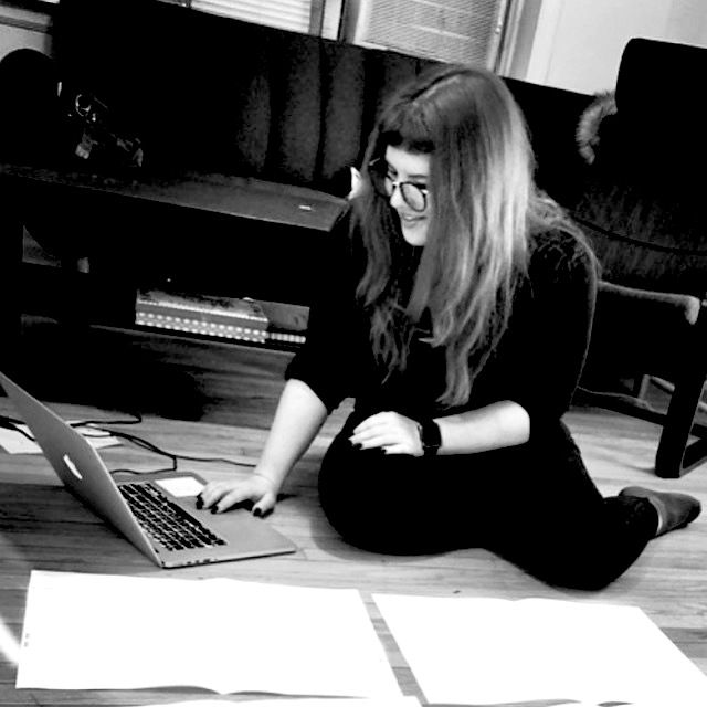 Me reviewing a bunch of design work on the floor.