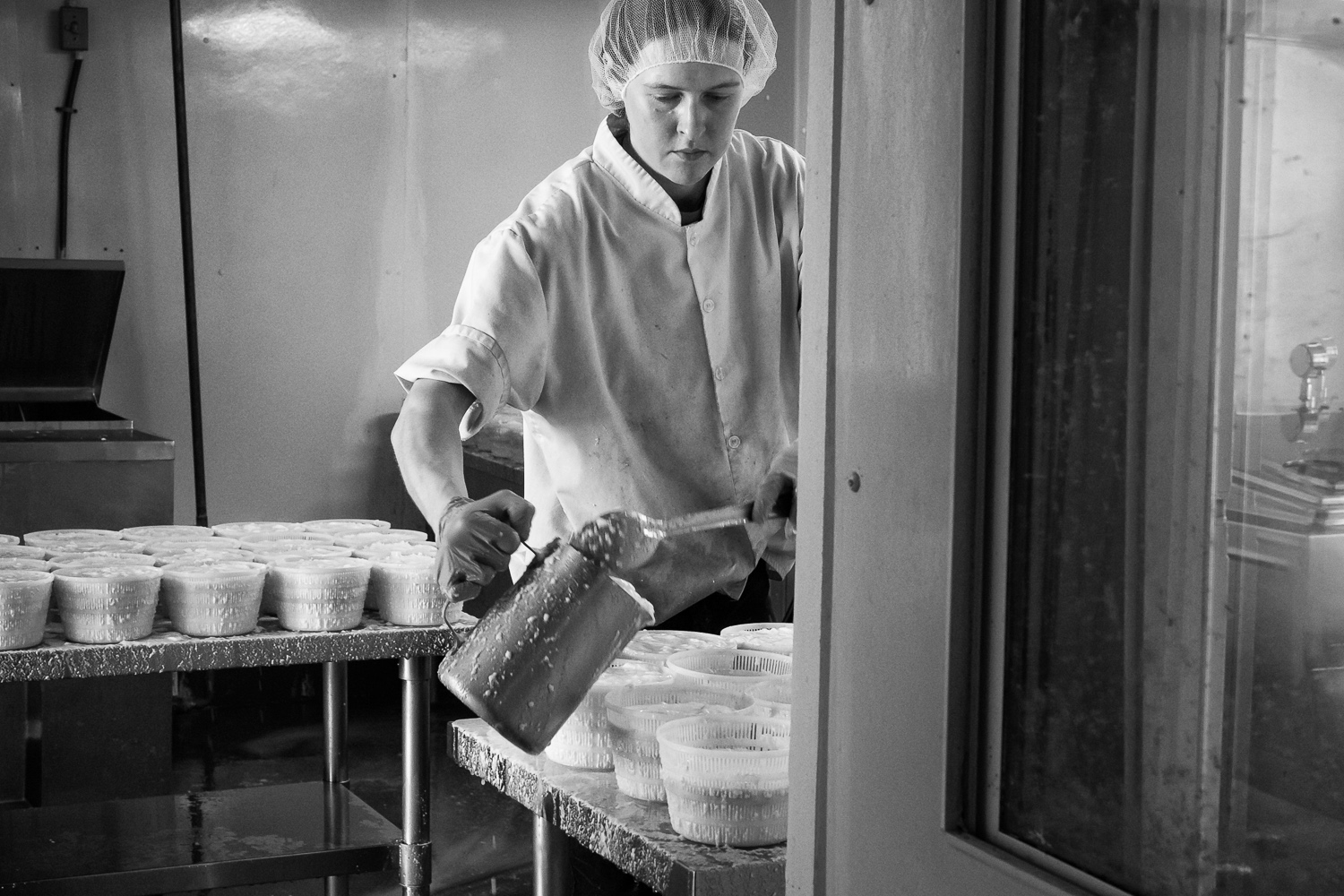 Megan making the cheese