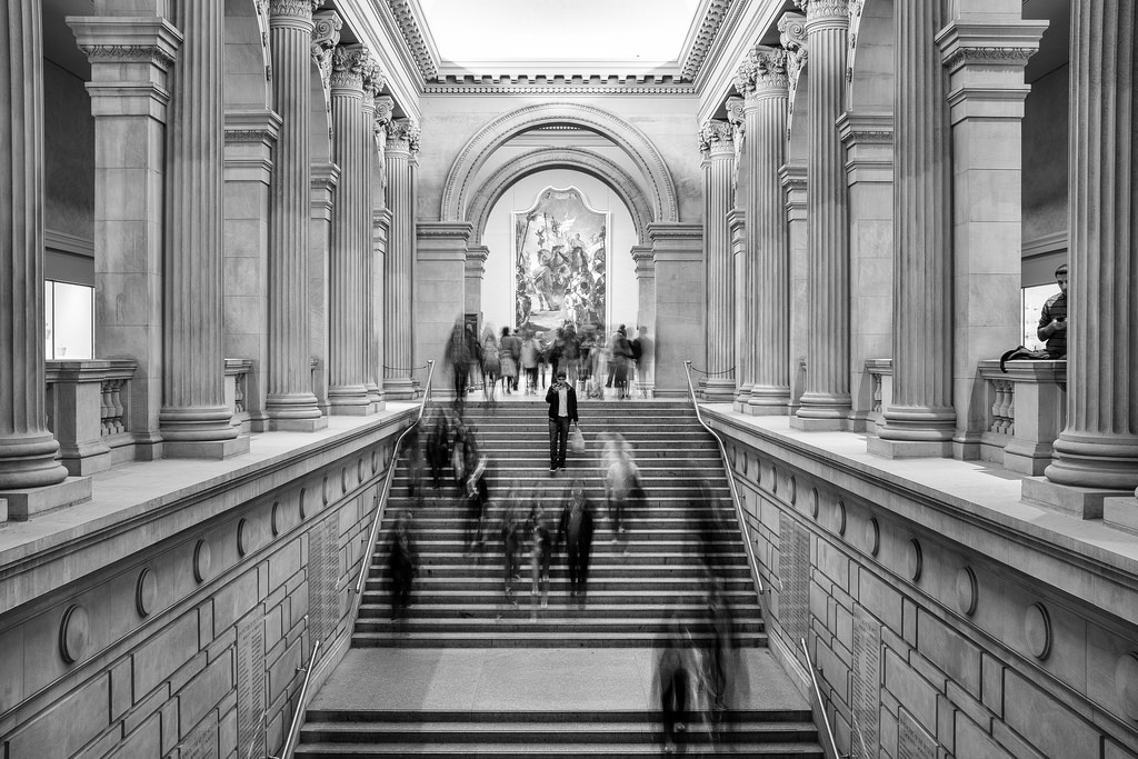 "Man in the Middle" January 2014, New York City Fujifilm X100s, 23mm, f/8, 2.1 sec, ISO 250 On a rainy weekend in January, my wife and I went to New York's Metropolitan Museum of Art. I was playing around with a slow shutter speed to give this stoic scene of the Grand Staircase a sense of energy. But then this guy stopped right in the center to check his phone, which froze him while everyone else blurred. Totally unplanned. But it totally made the shot. This may be the only instance in history where a guy checking his smartphone has actually improved a photo. 
