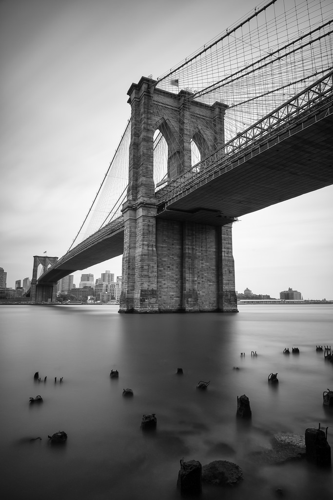 "Brooklyn Bridge" May 2014, New York City Fujifilm XPro1, 14mm, f/8, 240 seconds, ISO 200 Here's another shot from the same evening. I love how foggy the water looks around the pylons. The scene feels totally silent except for the flapping of the flag on top of the bridge. (Of course, it was far from it, with horns blaring overhead on the FDR Expressway)