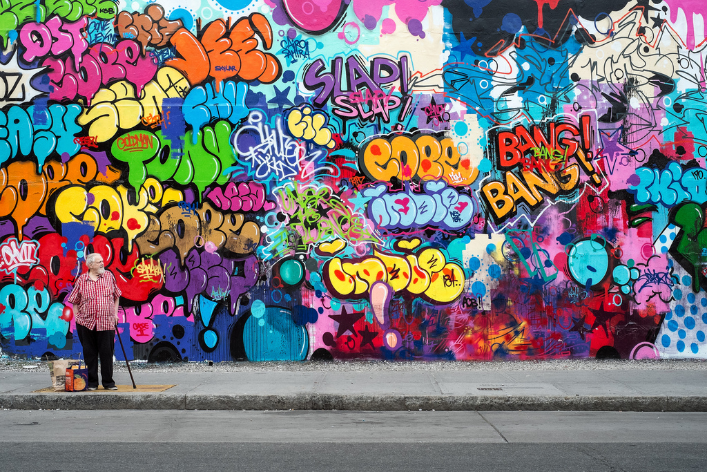 "Houston Street Noise" May, 2014, New York City Fujifilm XPro1, 35mm, f/8, 1/160 seconds, ISO 1600 This famous mural on the corner of Houston and Bowery Streets has had rotating artist installations for 30 years, including work by Keith Haring and Shepard Fairey. I've just learned that the wall has been temporarily dismantled for the construction of a new building. This mural by Cope2 was the final installation. 
