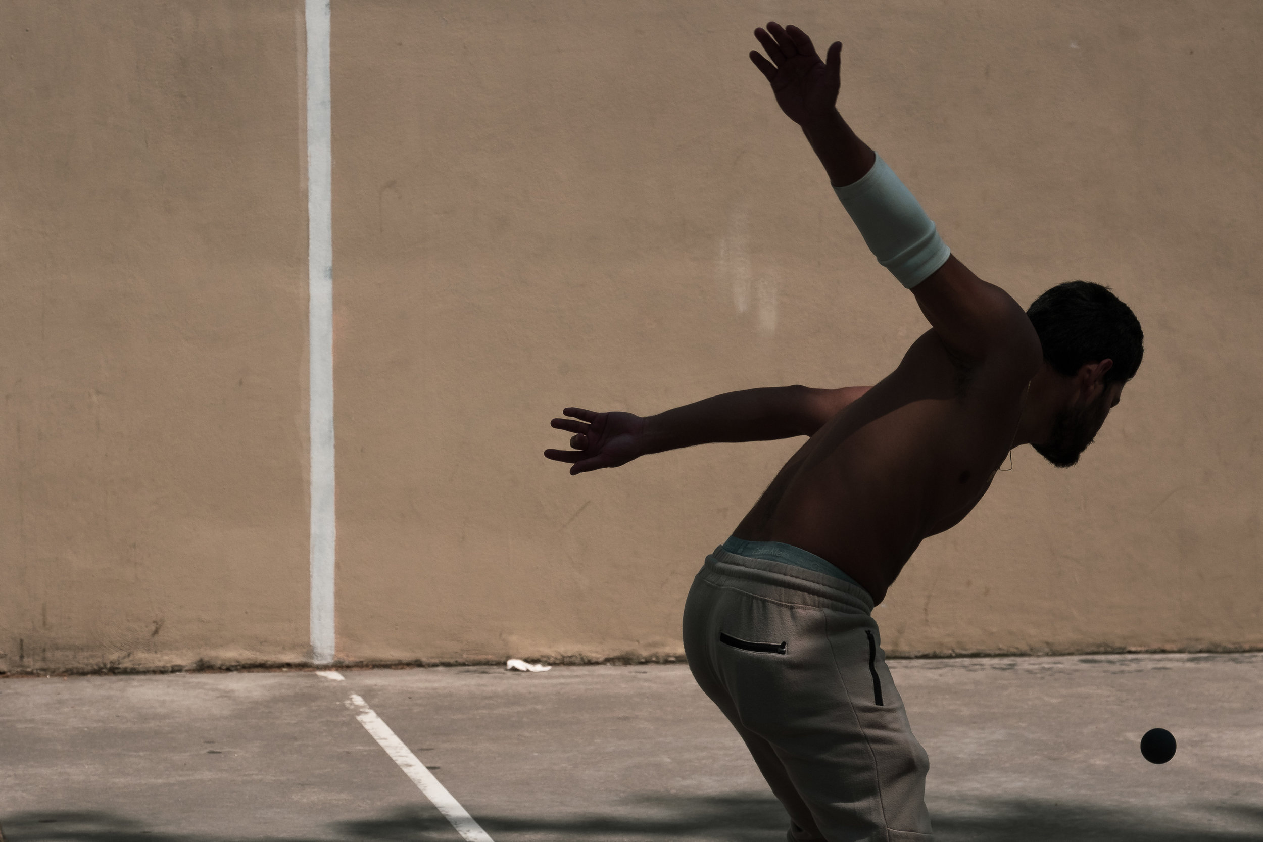 “Thwack!” May 25, 2018. Lower East Side, New York Fujifilm X Pro2, 55-200mm, f/9, 1/1250 sec, ISO 200 I caught some good shots of the handball players making contact with the ball too. But I much prefer the tension, anticipation and gesture in this moment-just-before-the-moment.
