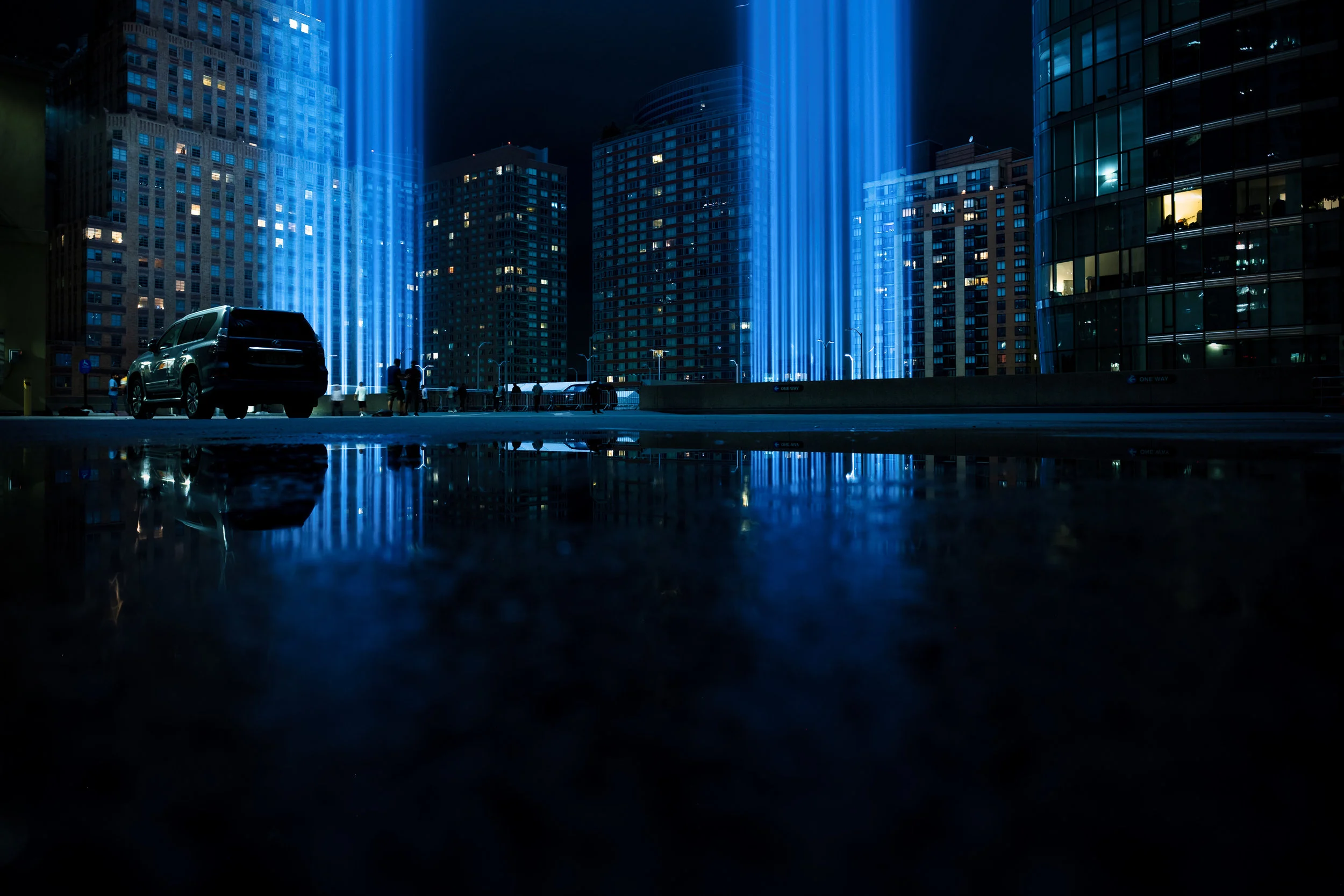 “Tribute Reflected” September 11, 2018. Lower Manhattan, New York Fujifilm XPro2, 14mm, f/3.2, 0.4 sec, ISO 200 This reflection was made in a puddle on the roof of the parking garage where they stage the lights.