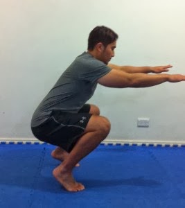 If your heels come up off the floor as you squat, you may be leaning too far forward or squatting too narrow.