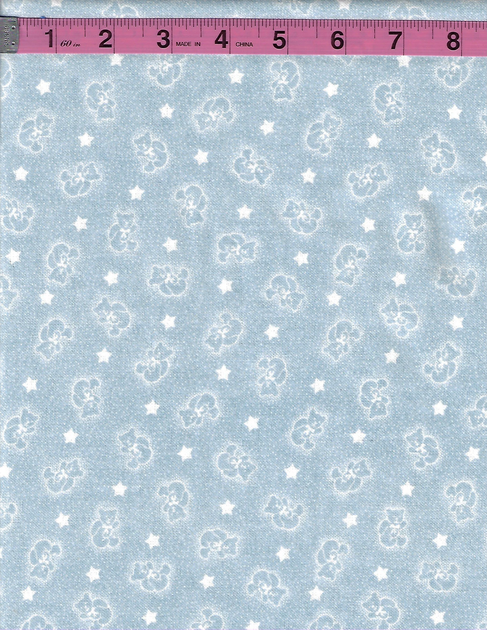 Blue 100% cotton flannel fabric with small white teddy bears and scattered white stars in an allover pattern.