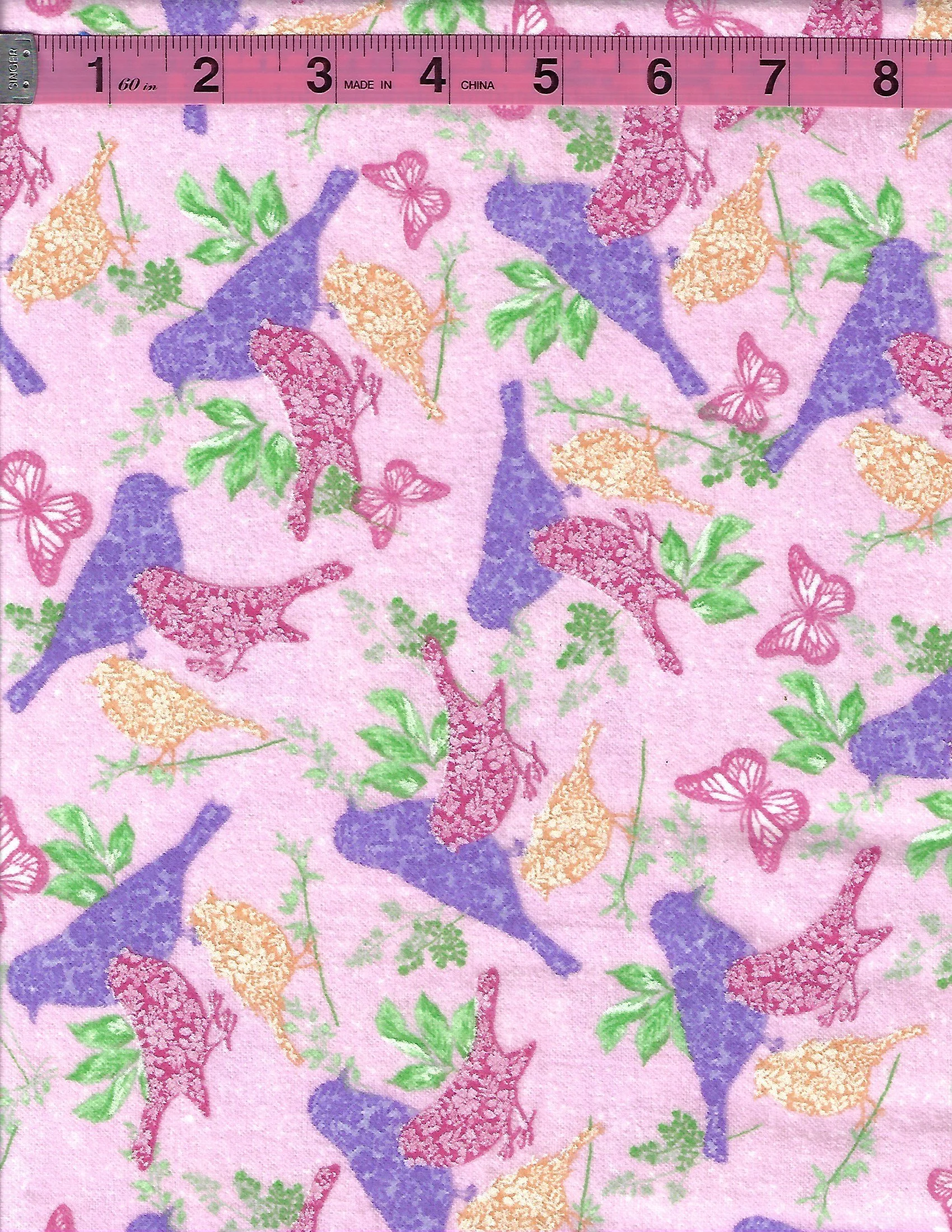 A.E. Nathan pink cotton flannel fabric with colorful birds, butterflies, and green leaves