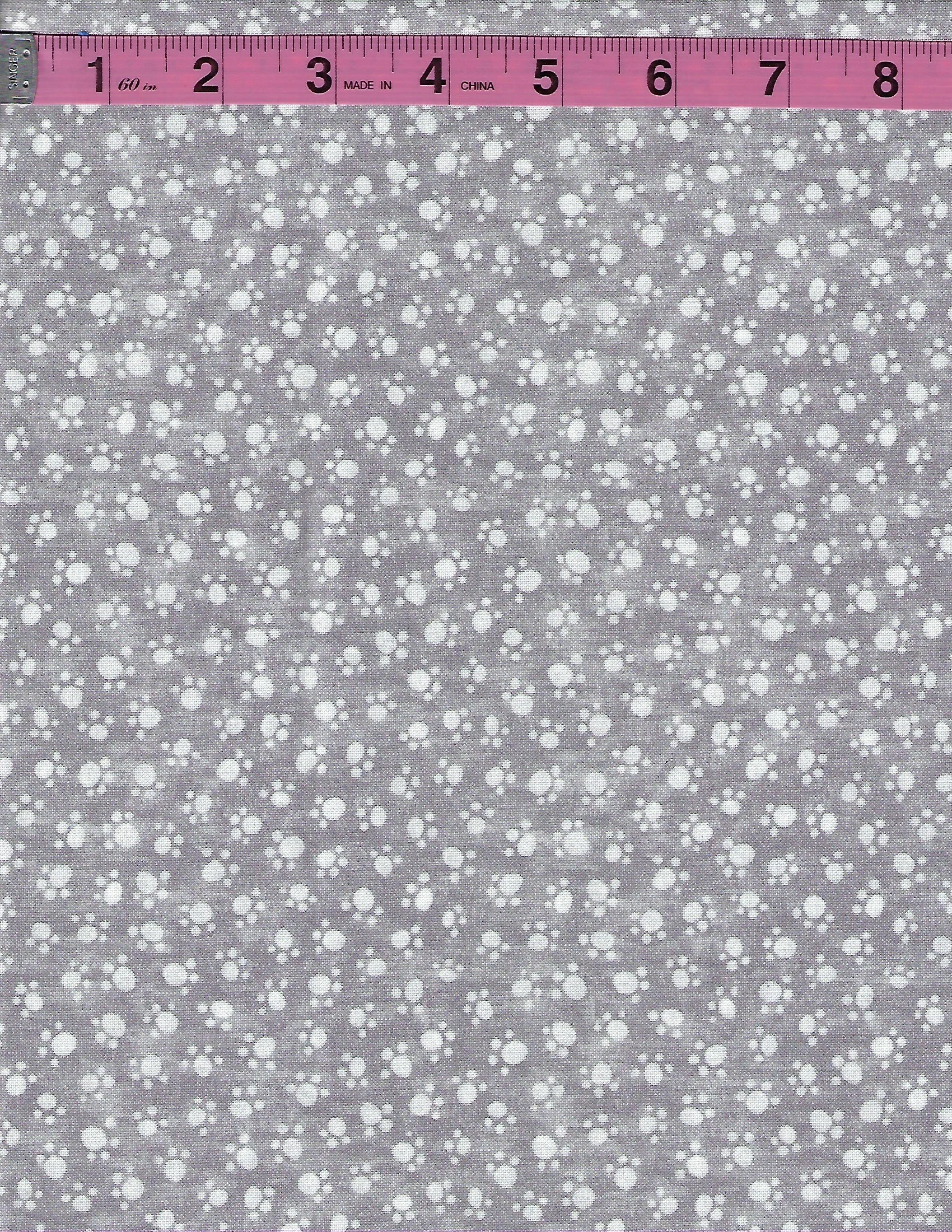 light gray cotton fabric featuring a scattered white pawprint pattern. A versatile neutral blender fabric perfect for quilting, sewing, patchwork and crafts.