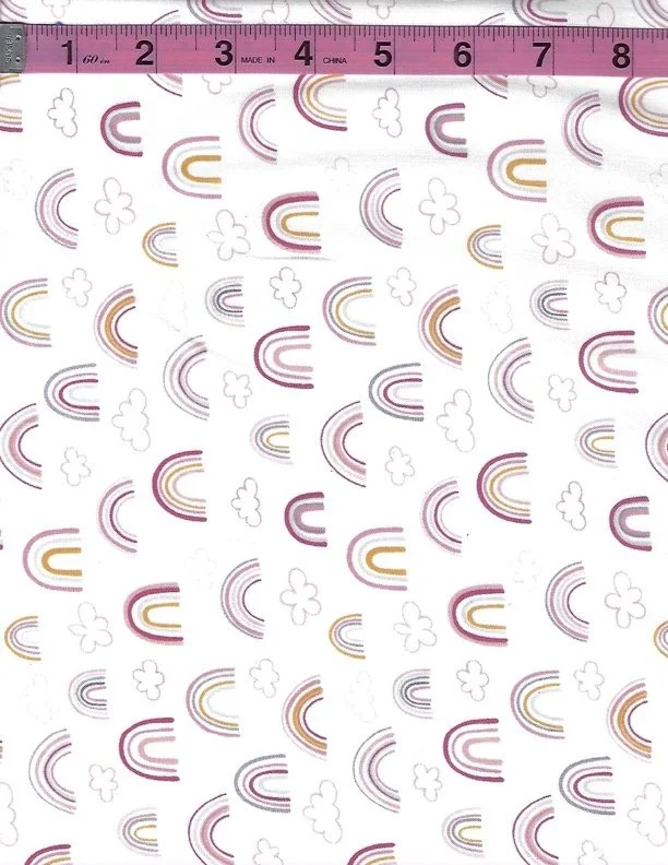 Studio E Porkopolis cotton fabric featuring cute pink pigs with rainbows and clouds on a white background
