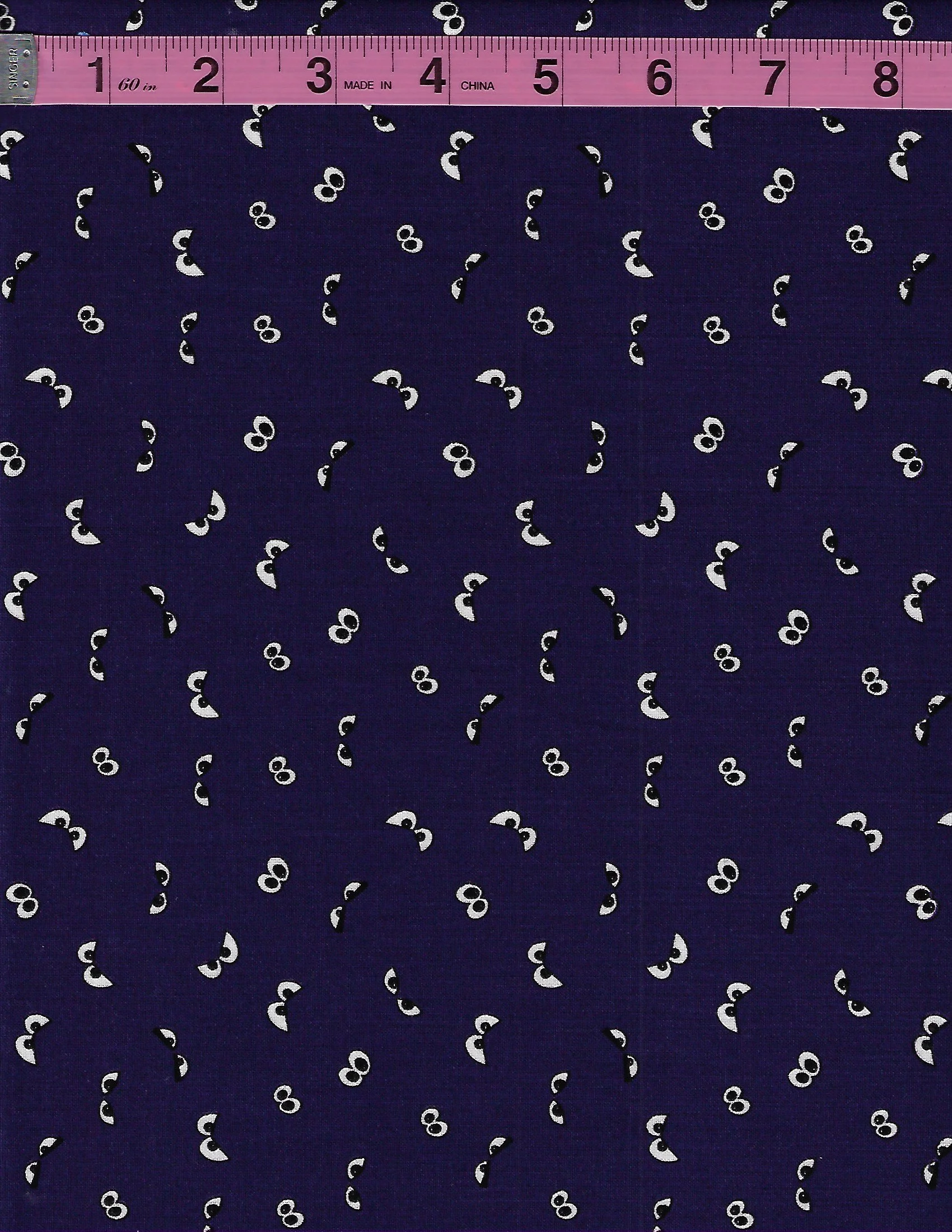 Riley Blake Spooky Hollow Eyes GC10576 is a glow-in-the-dark Halloween fabric with spooky eyes scattered across a rich eggplant purple background.