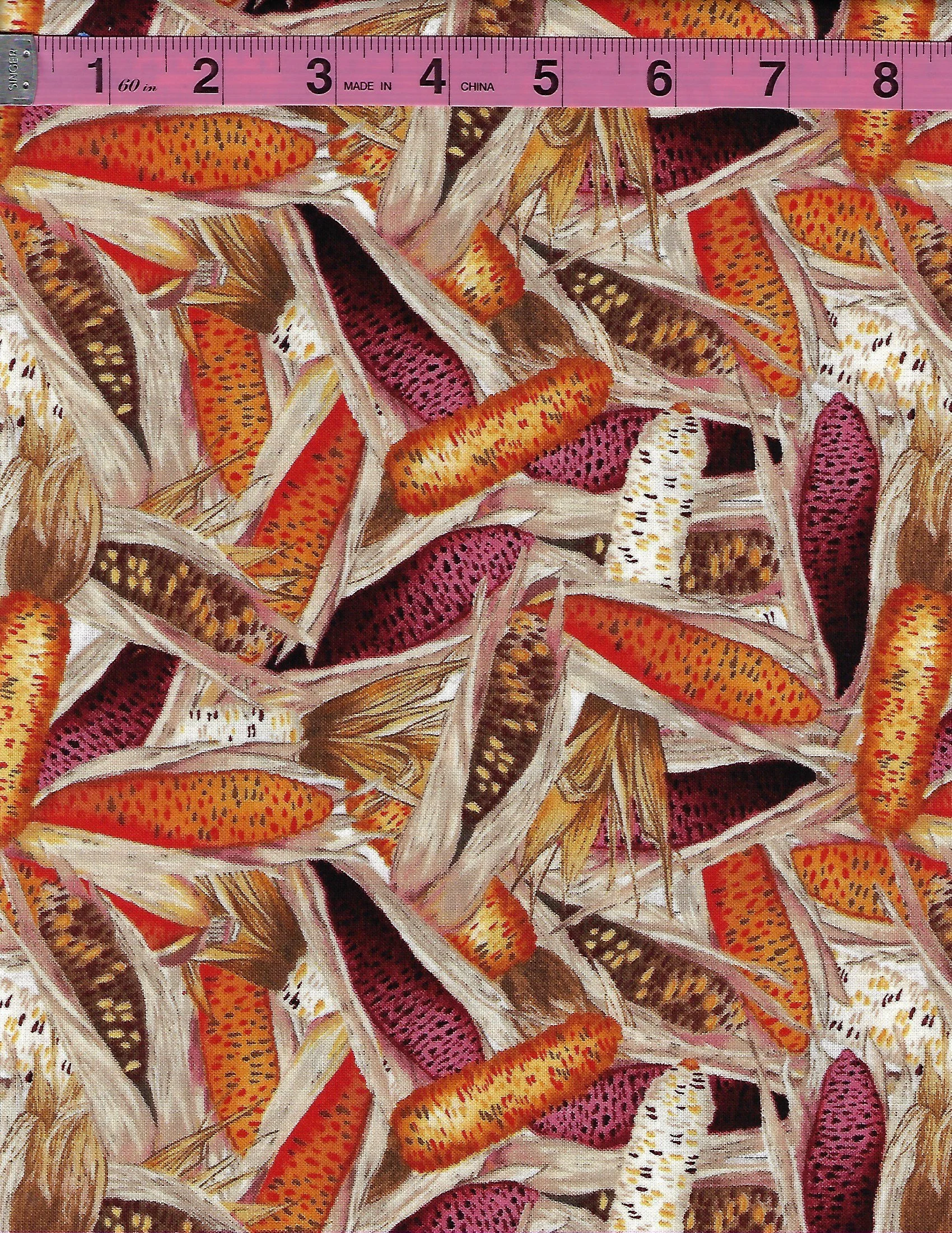 Collection of cotton fabrics featuring colorful corn cobs and bright orange sunflowers on light backgrounds