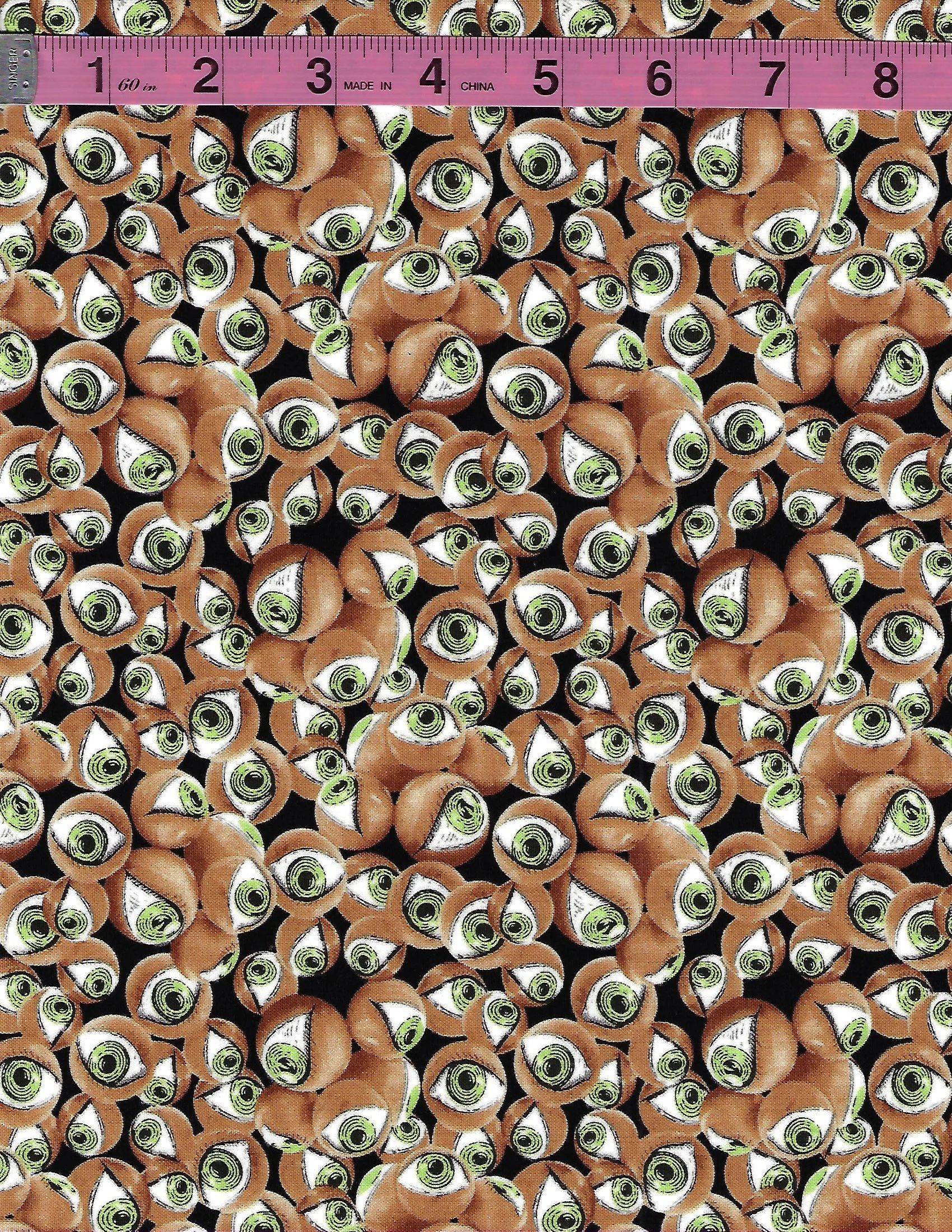 Glow in the dark Halloween cotton fabric featuring skeletons and eyeballs on black backgrounds