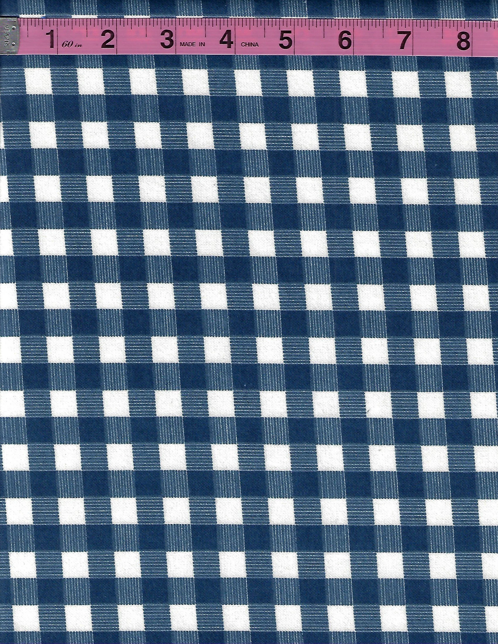 Riley Blake Designs High Adventure 100% cotton flannel fabric featuring a navy blue and white plaid pattern with woven stripe details.