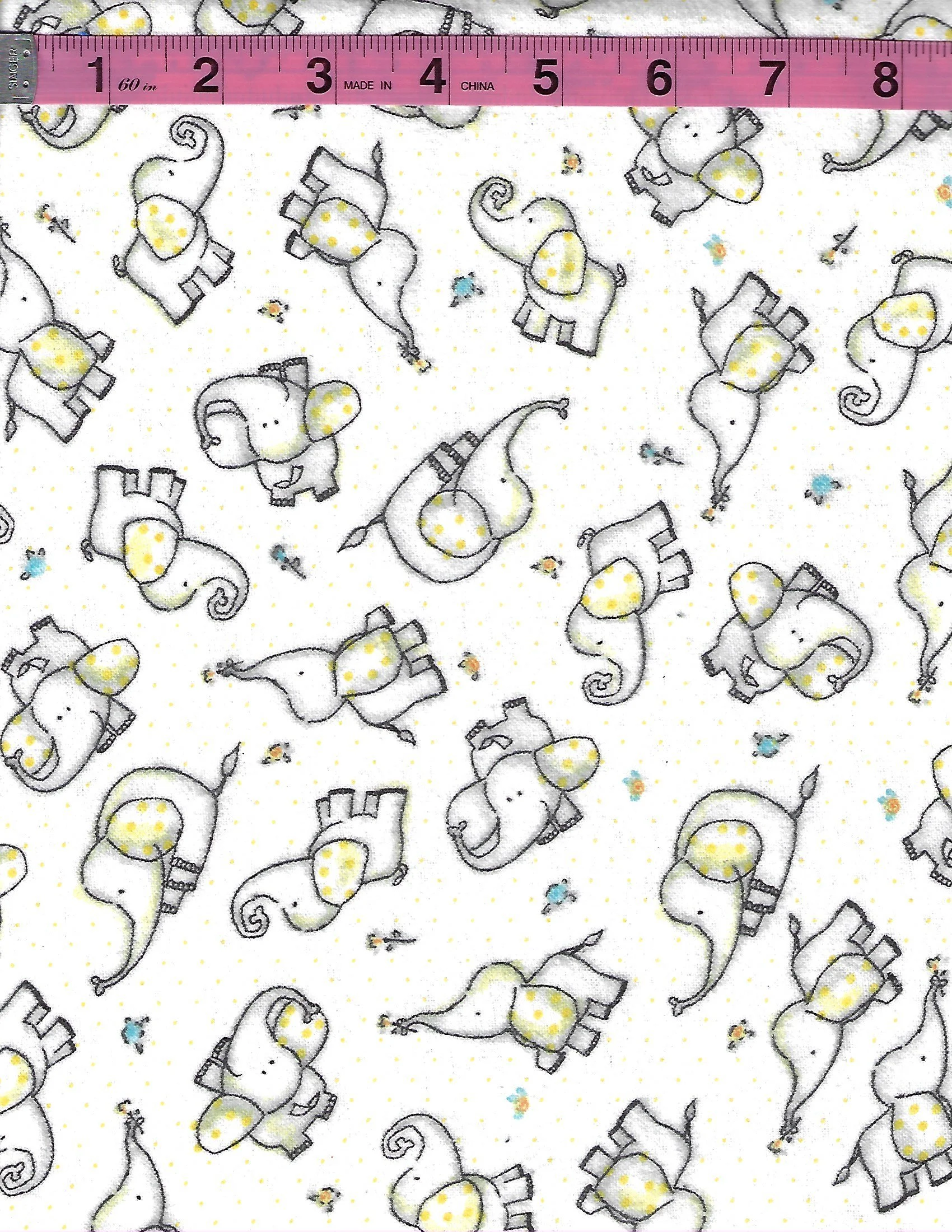 Mook Fabric 100% cotton flannel with adorable white elephants featuring yellow polka-dot accents on a white background with tiny colorful dots.