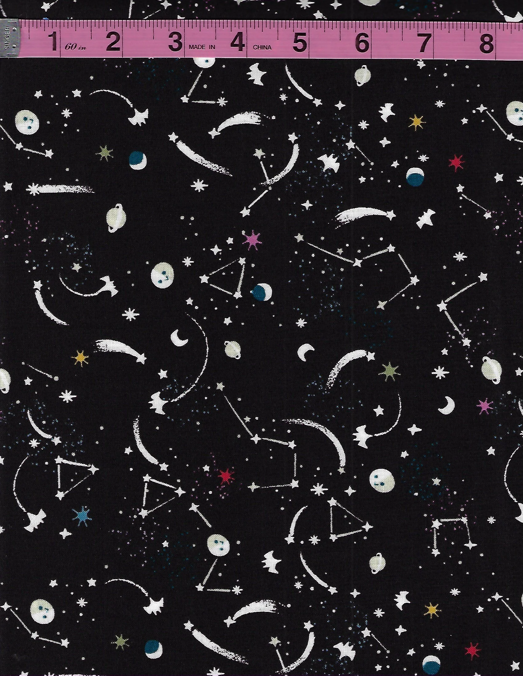Riley Blake Designs Tiny Treaters glow-in-the-dark Halloween fabric featuring whimsical spooky characters and celestial night-sky motifs on black.