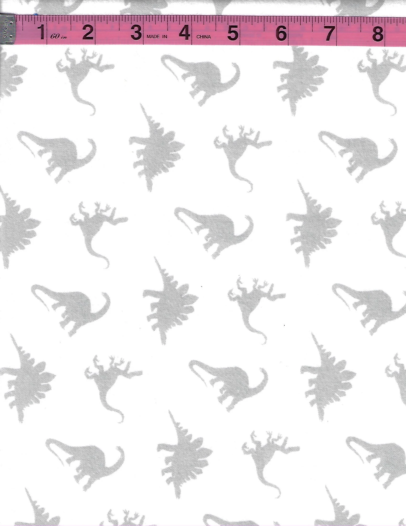 100% cotton flannel fabric with gray dinosaurs and prehistoric fern silhouettes on a white background.