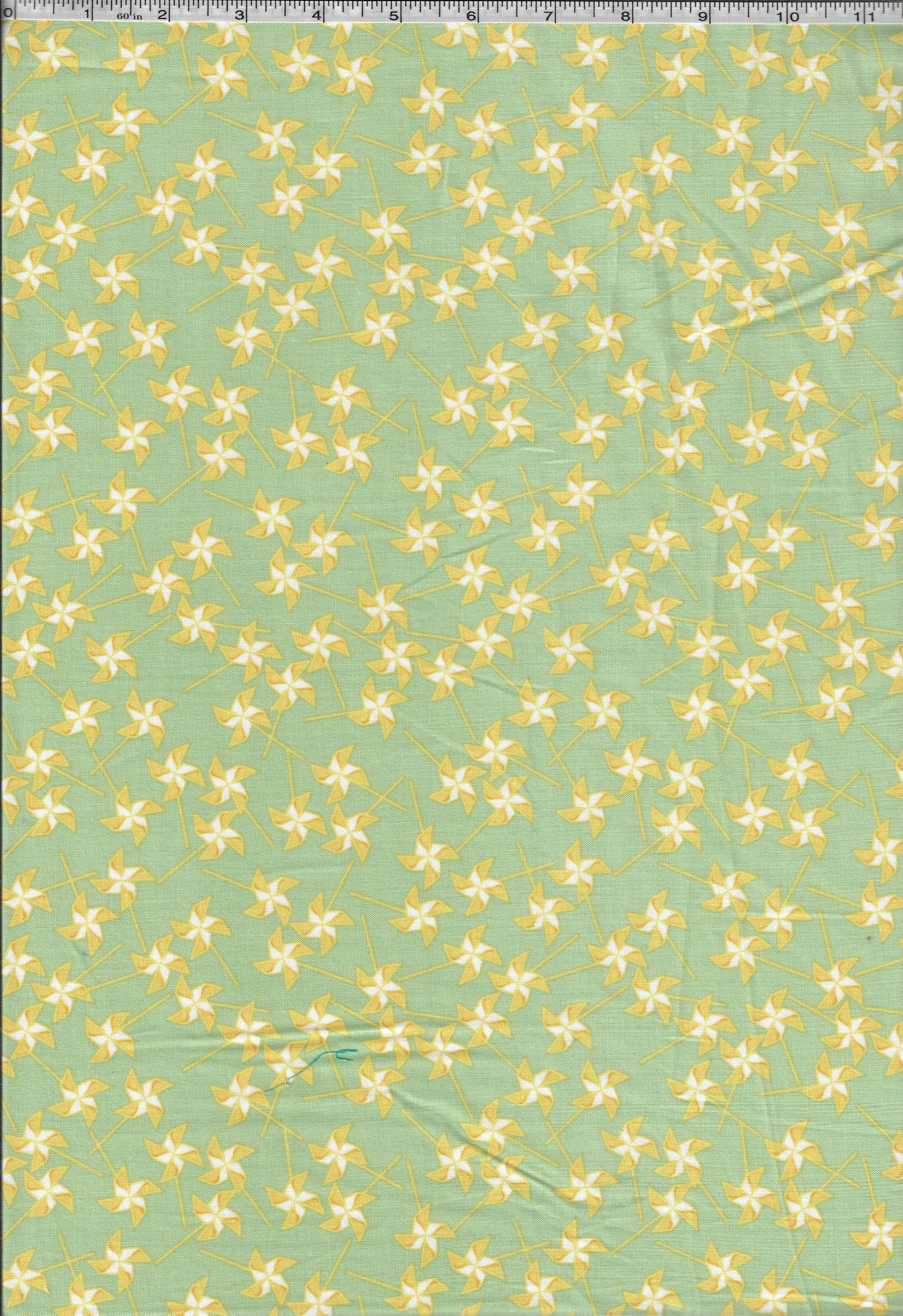 Three coordinating 100% cotton quilting fabrics featuring blue wind clouds, colorful kites on white, and small yellow flowers on a soft green background.