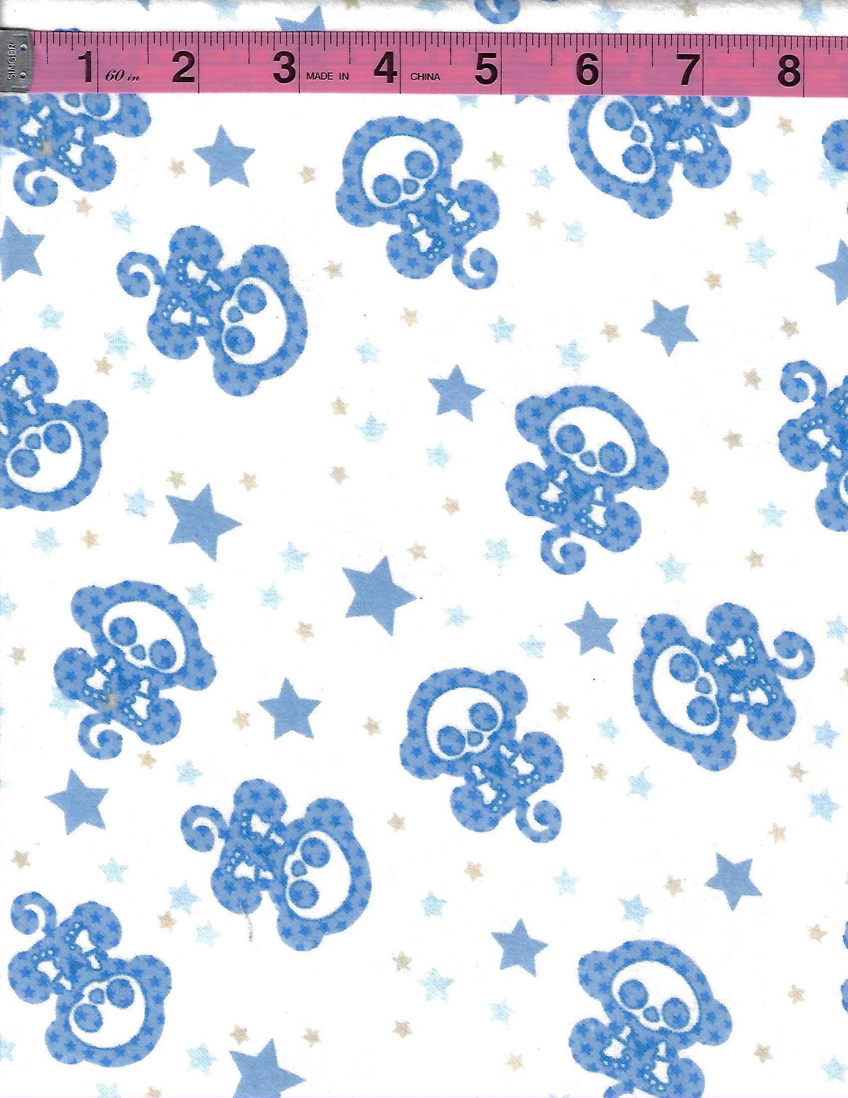 Cute and spooky Skelanimals fabric featuring blue skeleton monkey characters scattered across a white background with blue, light blue, and tan stars.