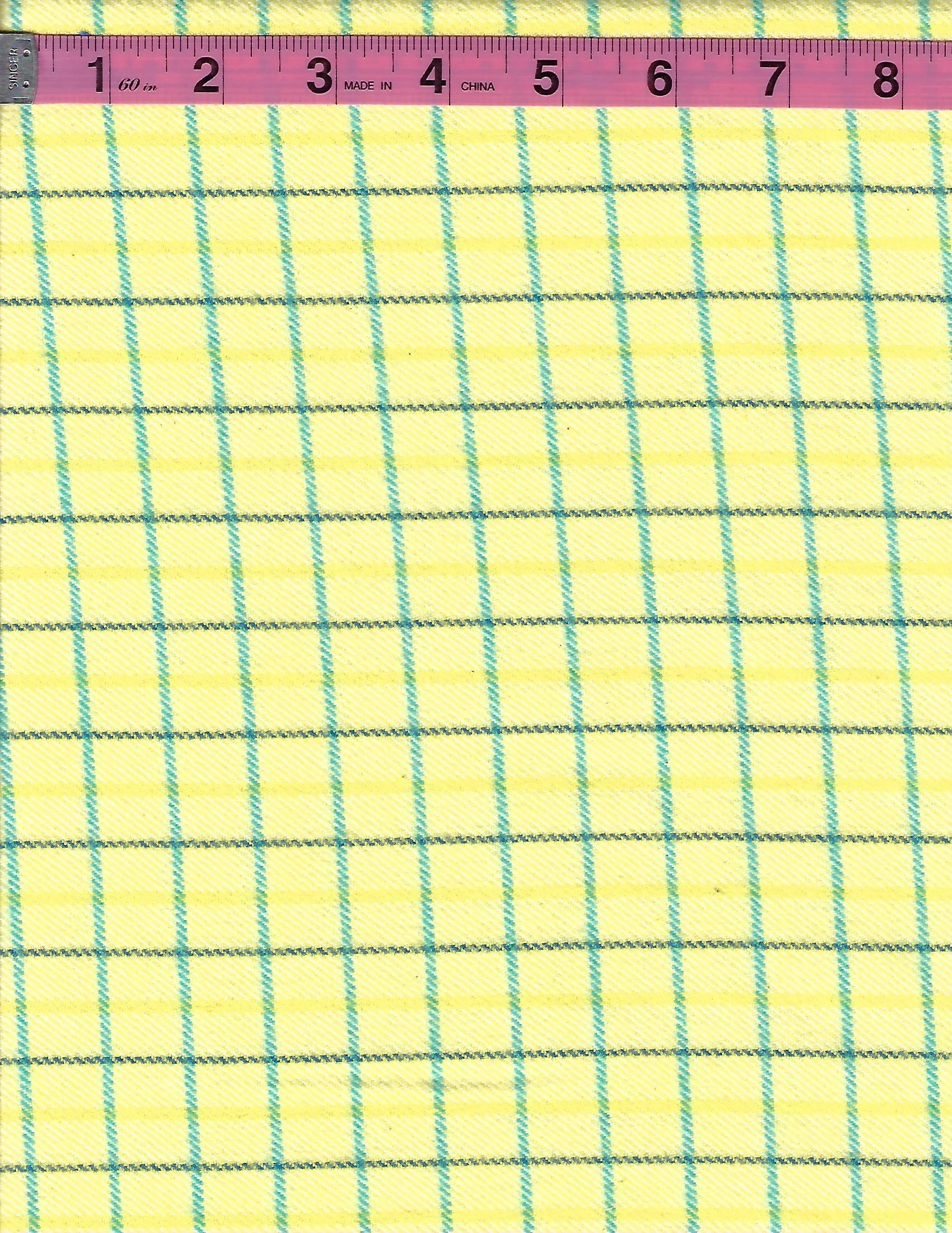 Marcus Fabrics yellow cotton flannel fabric with teal and blue-green plaid pattern